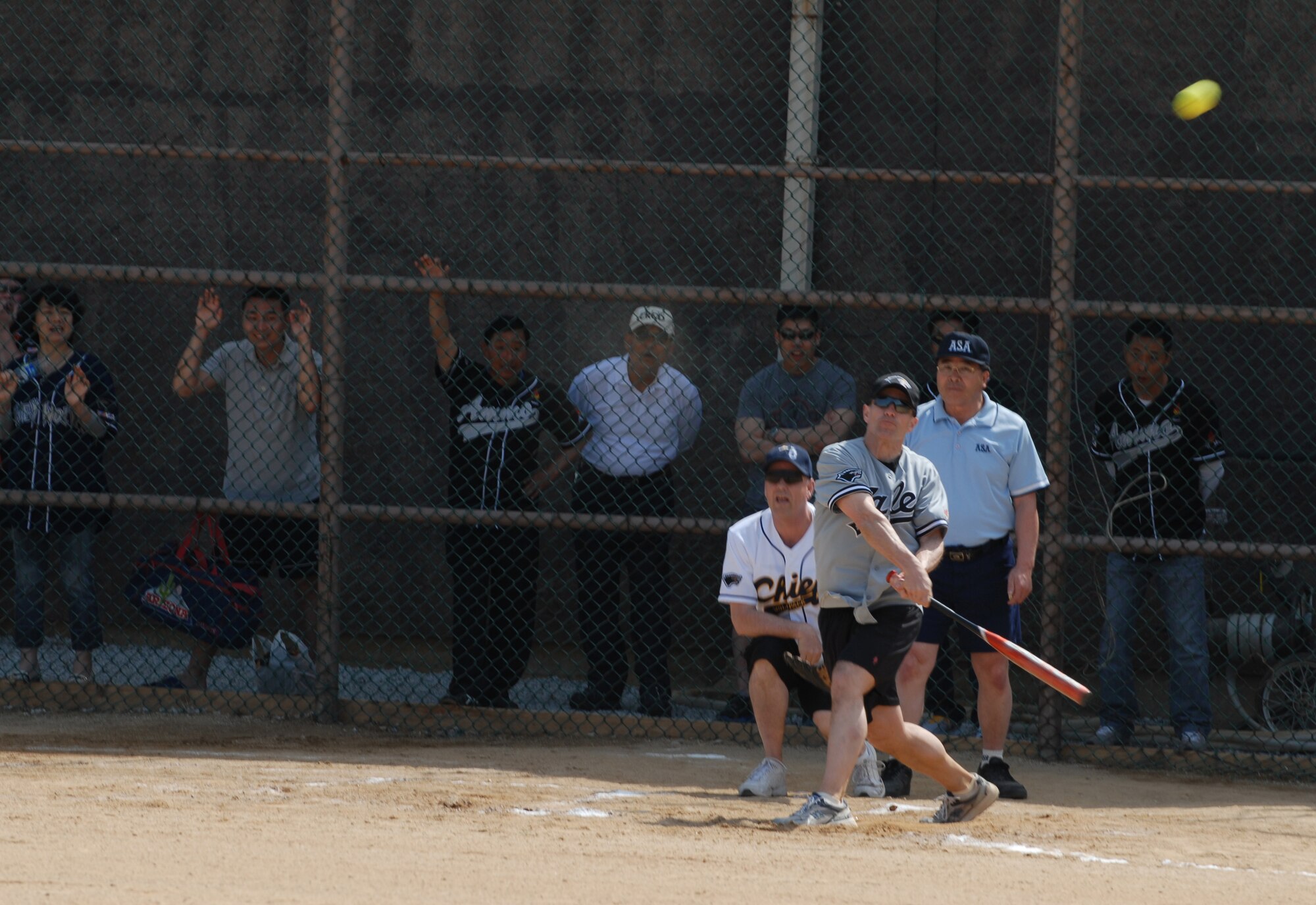 Col. Scott Pleus, 8th Fighter Wing commander, takes his best shot May, 4, 2012, during the Chiefs vs. Eagles softball game on Kunsan Air Base, Republic of Korea. Pleus, the 51st “Wolf” of the 8th FW, will soon move on to his next assignment at the Pentagon. (U.S. Air Force photo/Senior Airman Brigitte N. Brantley)