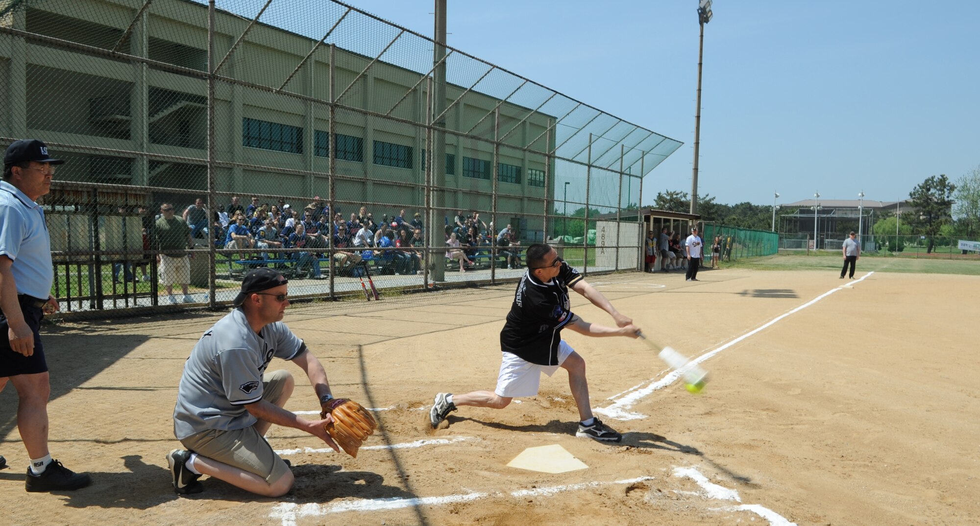 Chief Master Sgt. Paul Julbes from the 8th Maintenance Squadron takes a swing during the Chiefs vs. Eagles softball game May 4, 2012, on Kunsan Air Base, Republic of Korea. The chiefs’ strong plays led them to win 27-7. (U.S. Air Force photo/Senior Airman Brigitte N. Brantley)