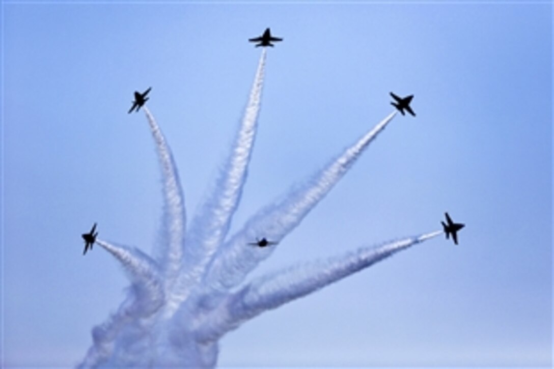 The Blue Angels, the Navy's flight demonstration squadron, shoot off in different directions during the 2012 Robins Air Show over Robins Air Force Base, Ga., April 29, 2012. 