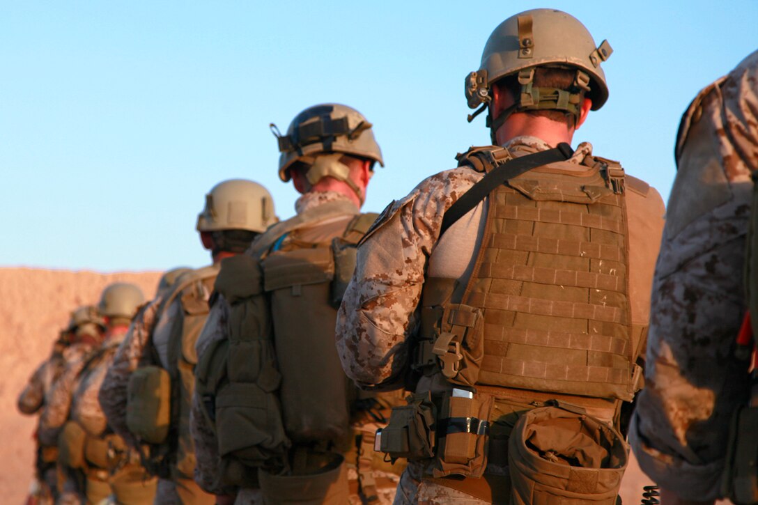 Force Reconnaissance Marines with the Assault Element, Maritime Raid Force, 15th Marine Expeditionary Unit, prepare to engage targets during a Special Operations Training Group live-fire qualification, May 8. The qualification involved shooting on the move from up to 50 yards away and for those armed with a pistol it included a weapons transition while closing in on a target. Additionally, it will lead to more in-depth exercises as the ground portion of Realistic Urban Training moves forward.