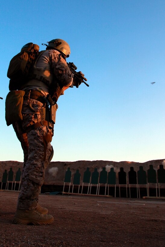 A Force Reconnaissance Marine with the Assault Element, Maritime Raid Force, 15th Marine Expeditionary Unit, engages a target during a Special Operations Training Group live-fire qualification, May 8. The qualification involved shooting on the move from up to 50 yards away and for those armed with a pistol it included a weapons transition while closing in on a target. Additionally, it will lead to more in-depth exercises as the ground portion of Realistic Urban Training moves forward.