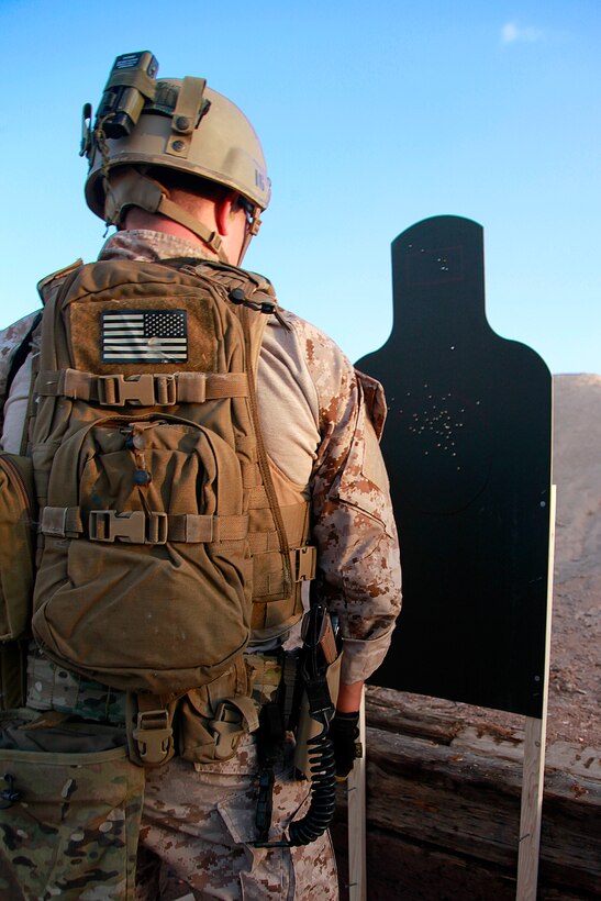 A Force Reconnaissance Marine with the Assault Element, Maritime Raid Force, 15th Marine Expeditionary Unit, observes his shot group on his target during a Special Operations Training Group live-fire qualification, May 8. The qualification involved shooting on the move from up to 50 yards away and for those armed with a pistol it included a weapons transition while closing in on a target. Additionally, it will lead to more in-depth exercises as the ground portion of Realistic Urban Training moves forward.