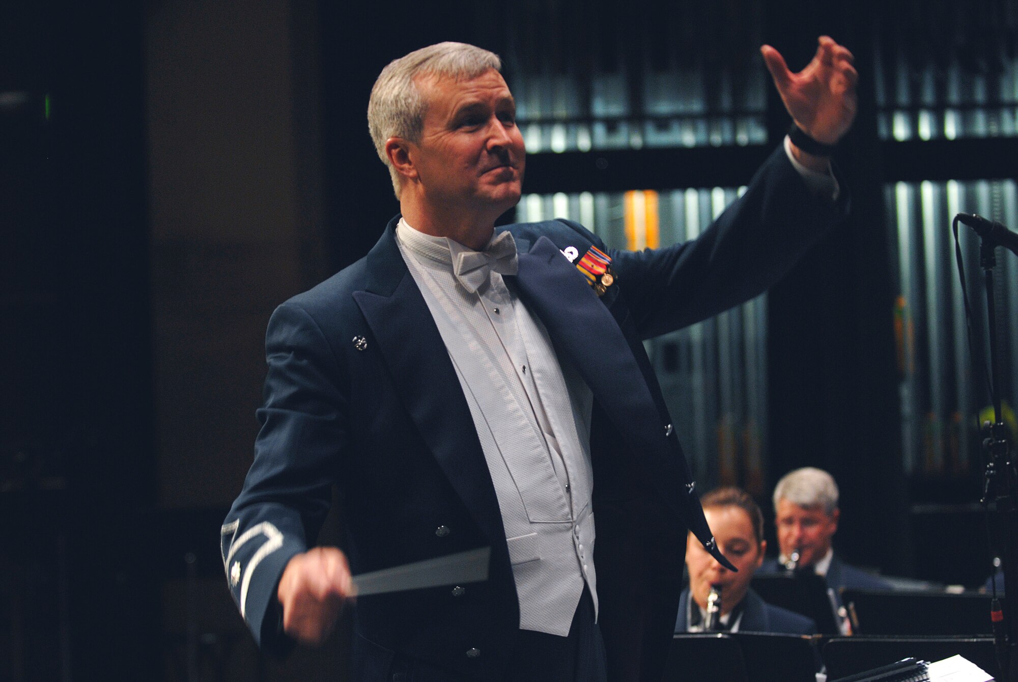 U.S. Air Force Band Commander, Col. Larry H. Lang conducts the band at an outreach concert.