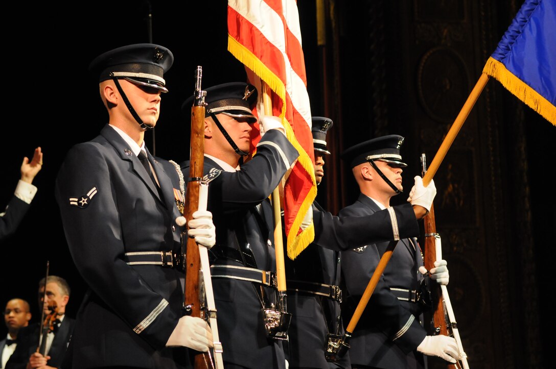 The U.S. Air Force Honor Guard Color Team present the colors at a U.S. Air Force Band outreach concert.