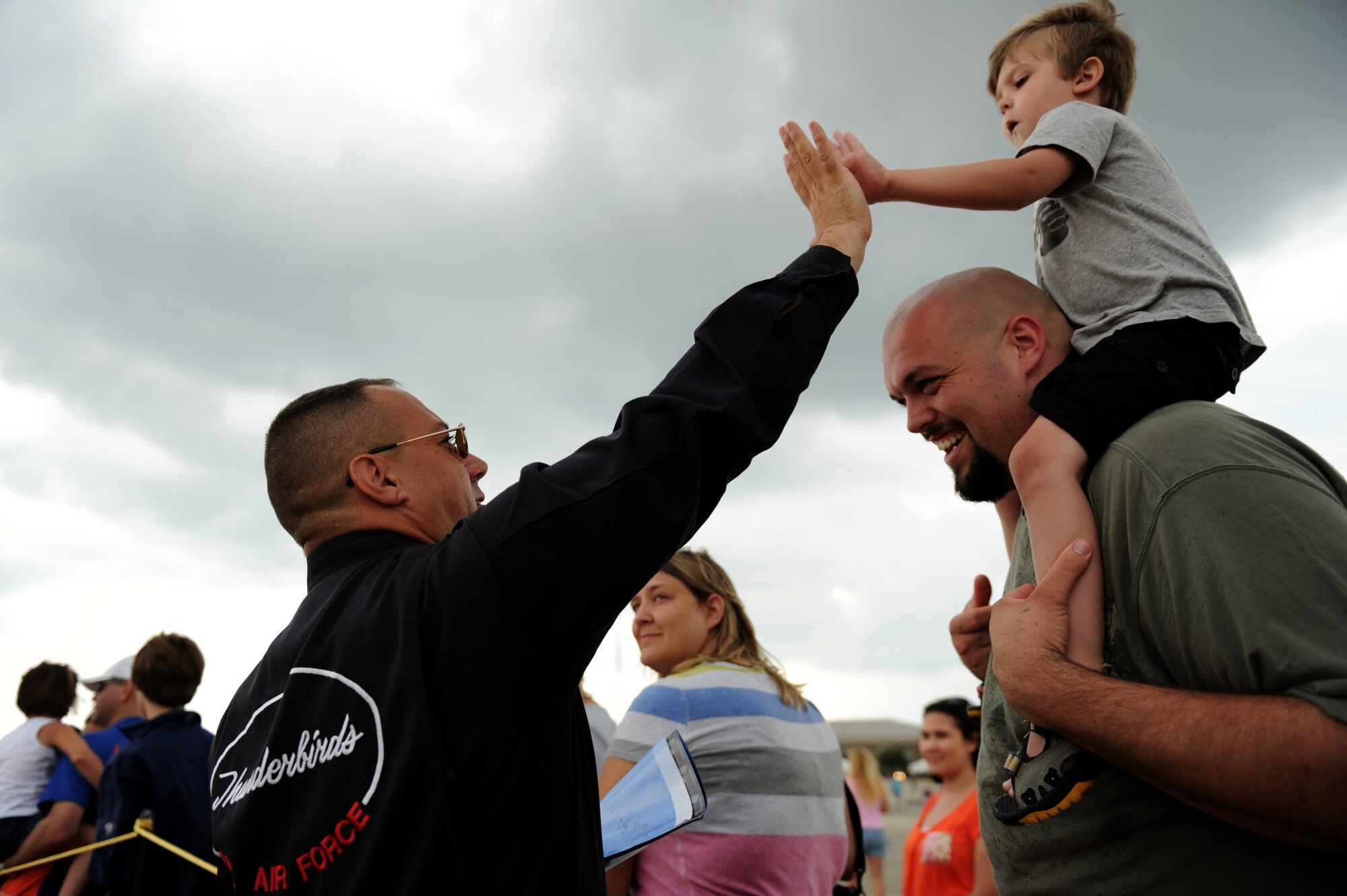 Chief Master Sergeant Tom Mical, Thunderbirds Chief Enlisted Manager, high-fives a young fan during the Shaw Air Expo at Shaw Air Force Base, S.C., May 6, 2012.
(U.S. Air Force photo/Staff Sgt. Larry E. Reid Jr., Released)