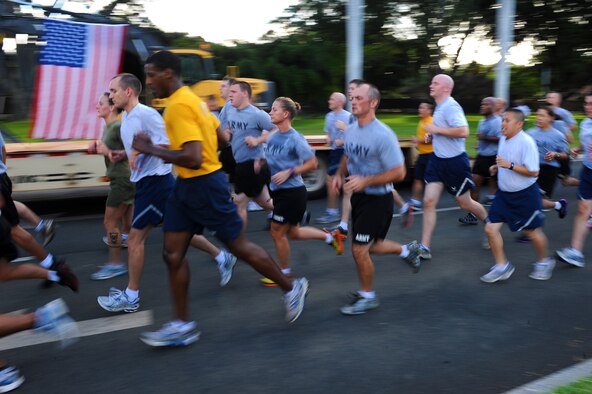Airmen, Soldiers, Sailors and Marines stationed at Joint Base Pearl Harbor-Hickam, Hawaii, sprint the final leg of the two-mile Team Hickam Warrior Run May 3. This event was sponsored by the 647th Civil Engineers Squadron and their Prime BEEF Airmen. Prime BEEF, is a Prime Base Engineer Emergency Force is a rapidly deployable, specialized civil engineer unit of the Air Force Prime BEEFs provide a full range of engineering support required to establish, operate, and maintain garrison and contingency airbases. The Prime BEEF motto is "If you mess with the bull, you get the horns." (U.S. Air Force photo/Staff Sgt. Mike Meares)