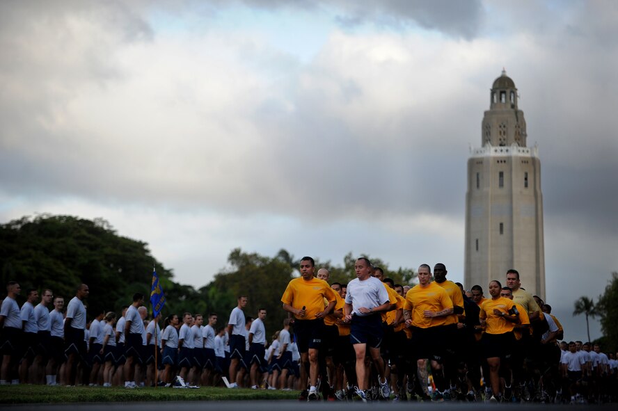 Col. Dann Carlson, Joint Base Pearl Harbor-Hickam vice commander and 647th Air Base Group commander, leads a flight of Airmen and Sailors along the two-mile Team Hickam Warrior Run May 3, JBPH-H, Hawaii.  This event was sponsored by the 647th Civil Engineers Squadron and their Prime BEEF Airmen. Prime BEEF, is a Prime Base Engineer Emergency Force is a rapidly deployable, specialized civil engineer unit of the Air Force Prime BEEFs provide a full range of engineering support required to establish, operate, and maintain garrison and contingency airbases. The Prime BEEF motto is ?If you mess with the bull, you get the horns.? (U.S. Air Force photo/Staff Sgt. Mike Meares)