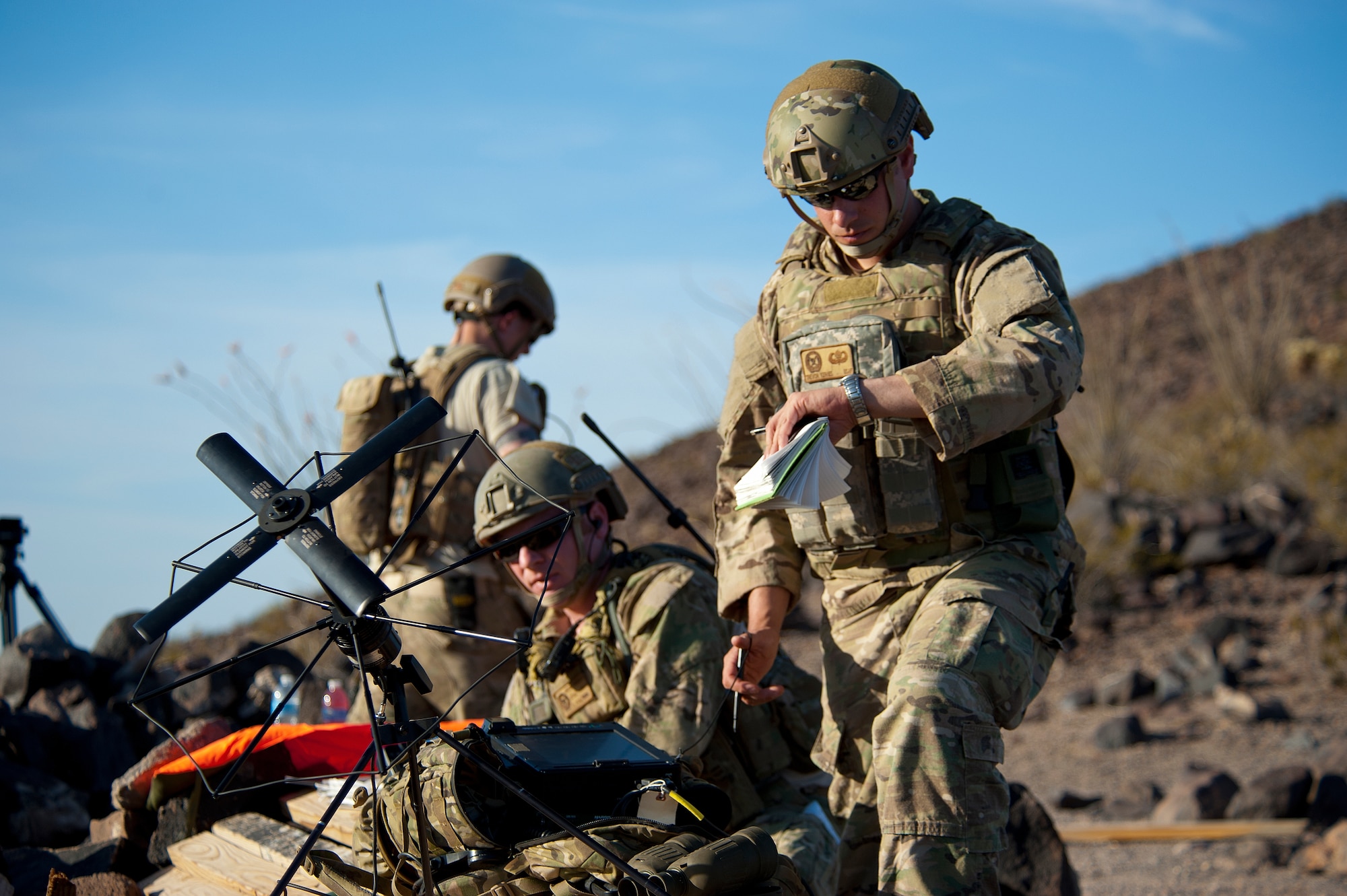 U.S. Air Force Master Sgt. Troy Carle, 116th Air Support Operations Squadron joint terminal attack controller instructor, checks the time on target of a strike called by Staff Sgt. Jacob Torgerson, 116th ASOS, during the exercise at the Barry M. Goldwater Range Complex, Ariz., May 03, 2012. (U.S. Air Force photo by Staff Sgt. Jason Colbert)