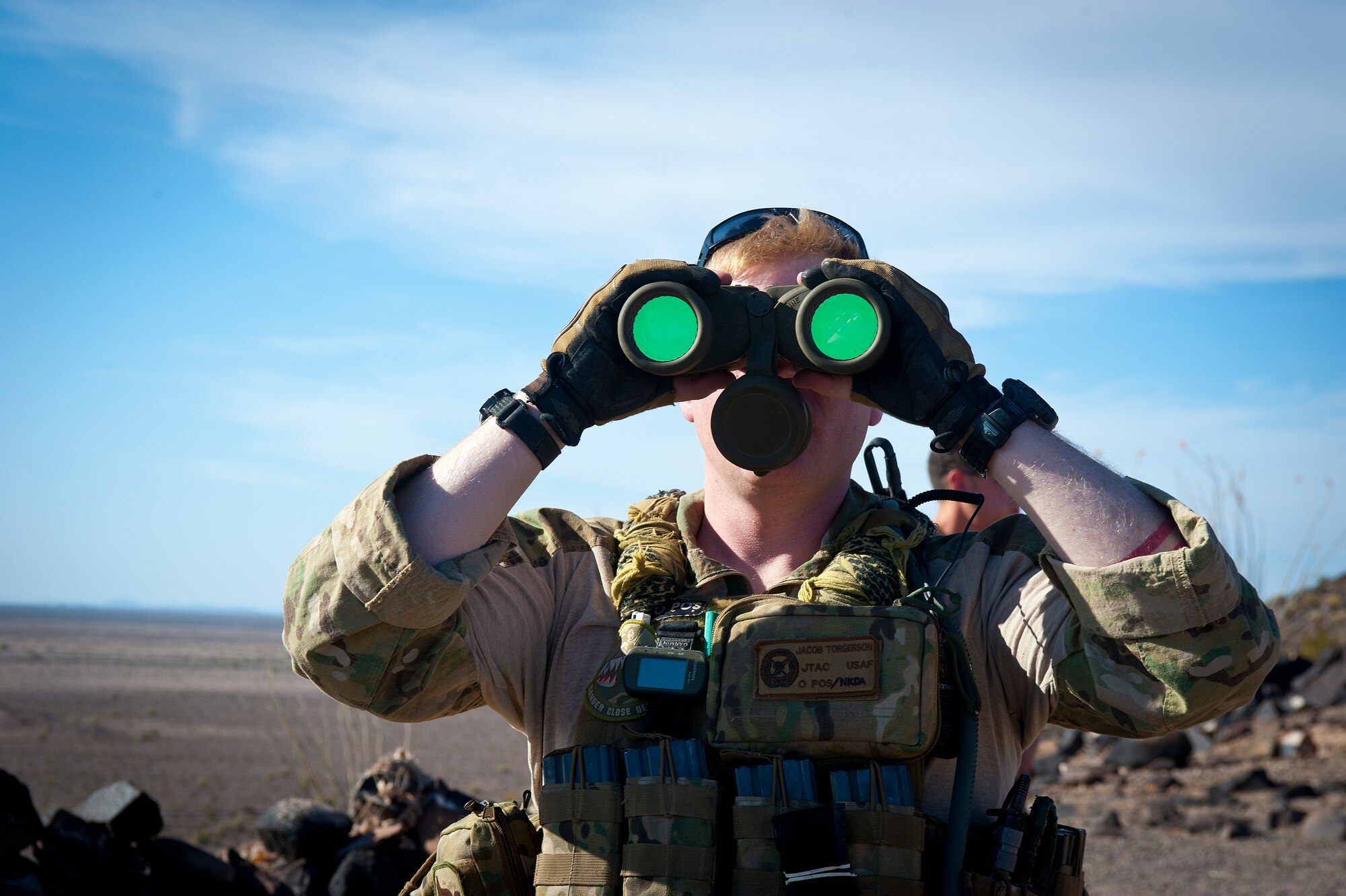 U.S. Air Force Staff Sgt. Jacob Torgerson, 116th Air Support Operations Squadron joint terminal attack controller, scans the area for potential threats during the exercise at the Barry M. Goldwater Range Complex, Ariz., May 03, 2012. The 116th ASOS is an Air National Guard unit from Camp Murray, Wash. (U.S. Air Force photo by Staff Sgt. Jason Colbert)