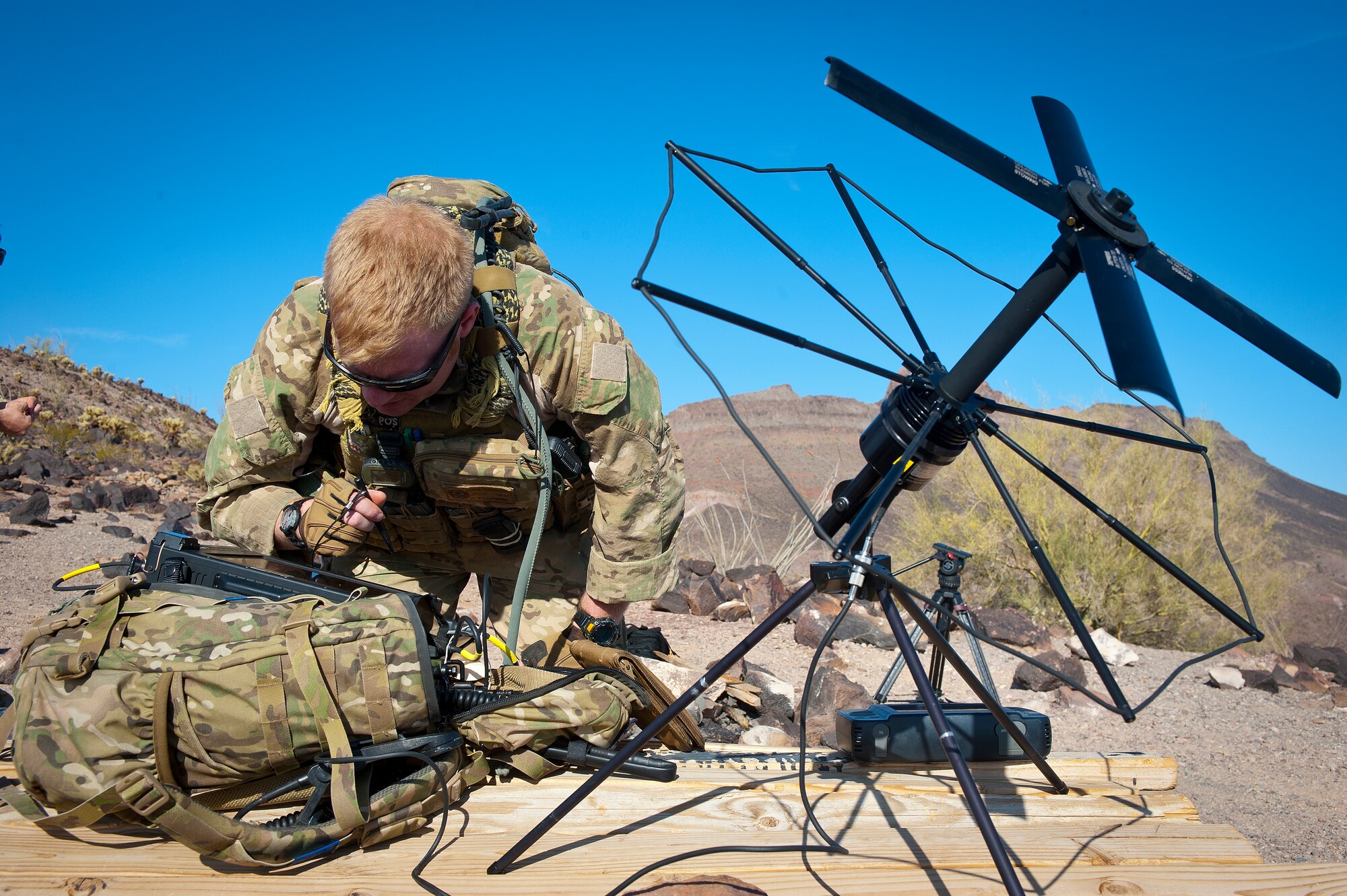 U.S. Air Force Staff Sgt. Jacob Torgerson, 116th Air Support Operations Squadron joint terminal attack controller, calibrates his equipment prior to the start of the exercise at the Barry M. Goldwater Range Complex, Ariz., May 03, 2012. JTACs provide ground level guidance of munitions and help to deconflict aircraft. (U.S. Air Force photo by Staff Sgt. Jason Colbert)
