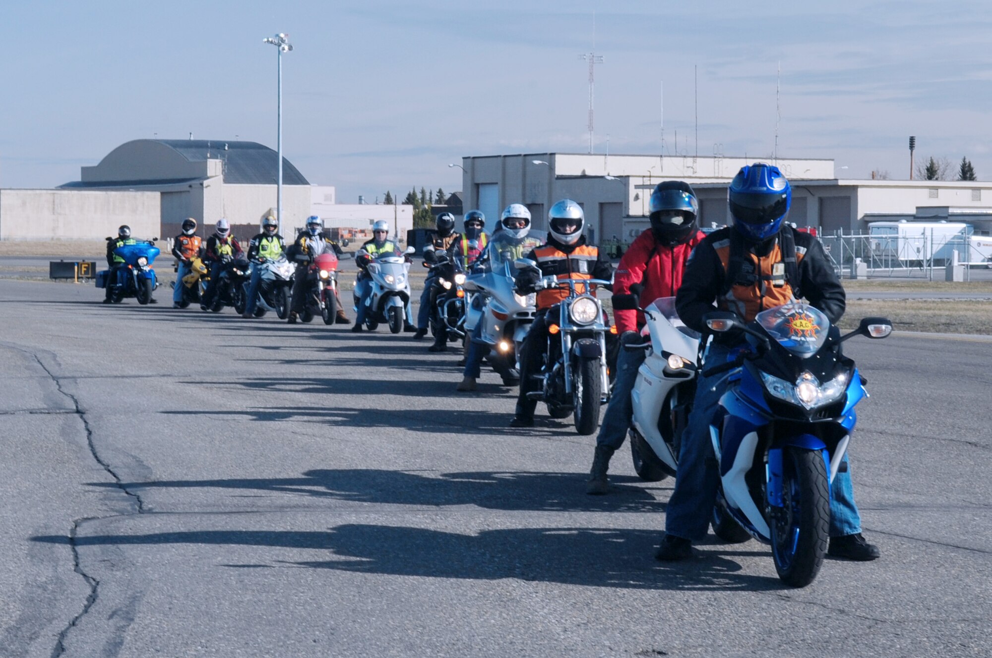 U.S. Air Force Airmen from Eielson Air Force Base form up on the flight line during the “Blessing of the Bikers and Mentorship Ride” May 5, 2012, Eielson Air Force Base, Alaska.  Airmen from the 354th Fighter Wing and 168th Air Refueling Wing rode to promote safety and camaraderie among fellow bikers. (U.S. Air Force photo/Airman 1st Class Lauren-Taylor Garcia)  