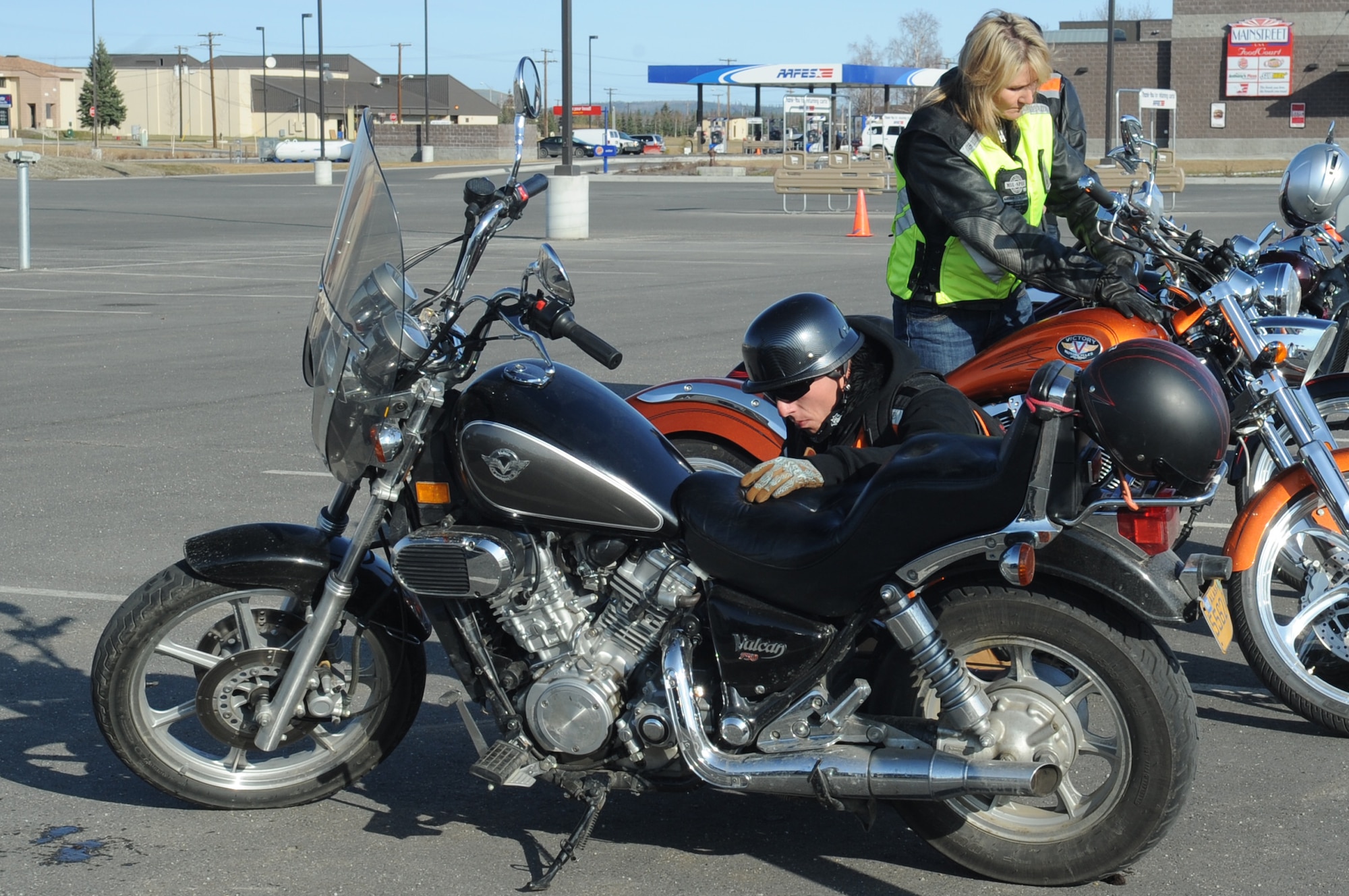 U.S. Air Force Airmen from Eielson Air Force Base do a tire, controls, lights, oil, chassis and kickstand inspection during the “Blessing of the Bikers and Mentorship Ride” May 5, 2012, Eielson Air Force Base, Alaska. A TCLOCK inspection is a pre-ride safety inspection to identify some of the motorcycle parts that fail more often than others.  (U.S. Air Force photo/Airman 1st Class Lauren-Taylor Garcia)