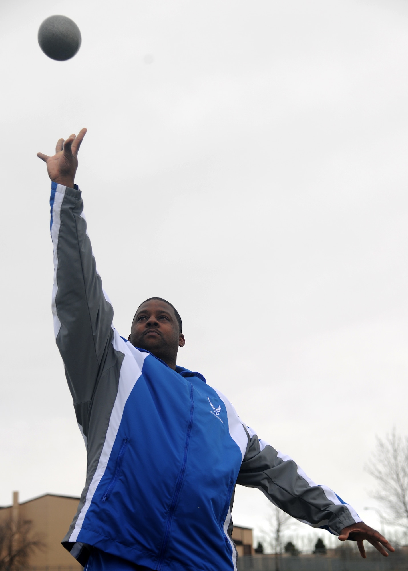 Tech. Sgt. Kevin Murphy, 319th Civil Engineering Squadron, throws a shot put April 20, 2012, on Grand Forks Air Force Base, N.D. Murphy earned first place in men's shot put open combined at the 2012 Warrior Games. (U.S. Air Force photo/Airman 1st Class Ashley N. Taylor)