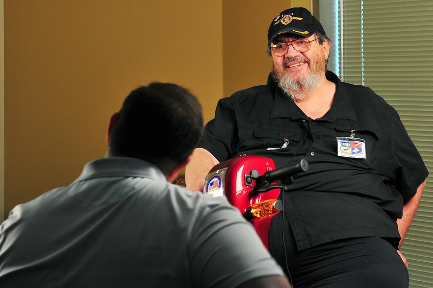U.S. Air Force civilian David Hopper, 55th Wing Public Affairs, interviews Danny Russell, member of the Prop Wash Gang, during the Doggers and Prop Wash Gang visit to the 97th Intelligence Squadron headquarters building on Offutt Air Force Base, Neb., April 27. The Prop Wash Gang is a group of hundreds of current and former intelligence and reconnaissance flyers. The group was founded by Larry Tart in conjunction with the establishment of Vigilance Park at Ft. George G. Meade, Md.(U.S. Air Force photo by Charles Haymond/Released)