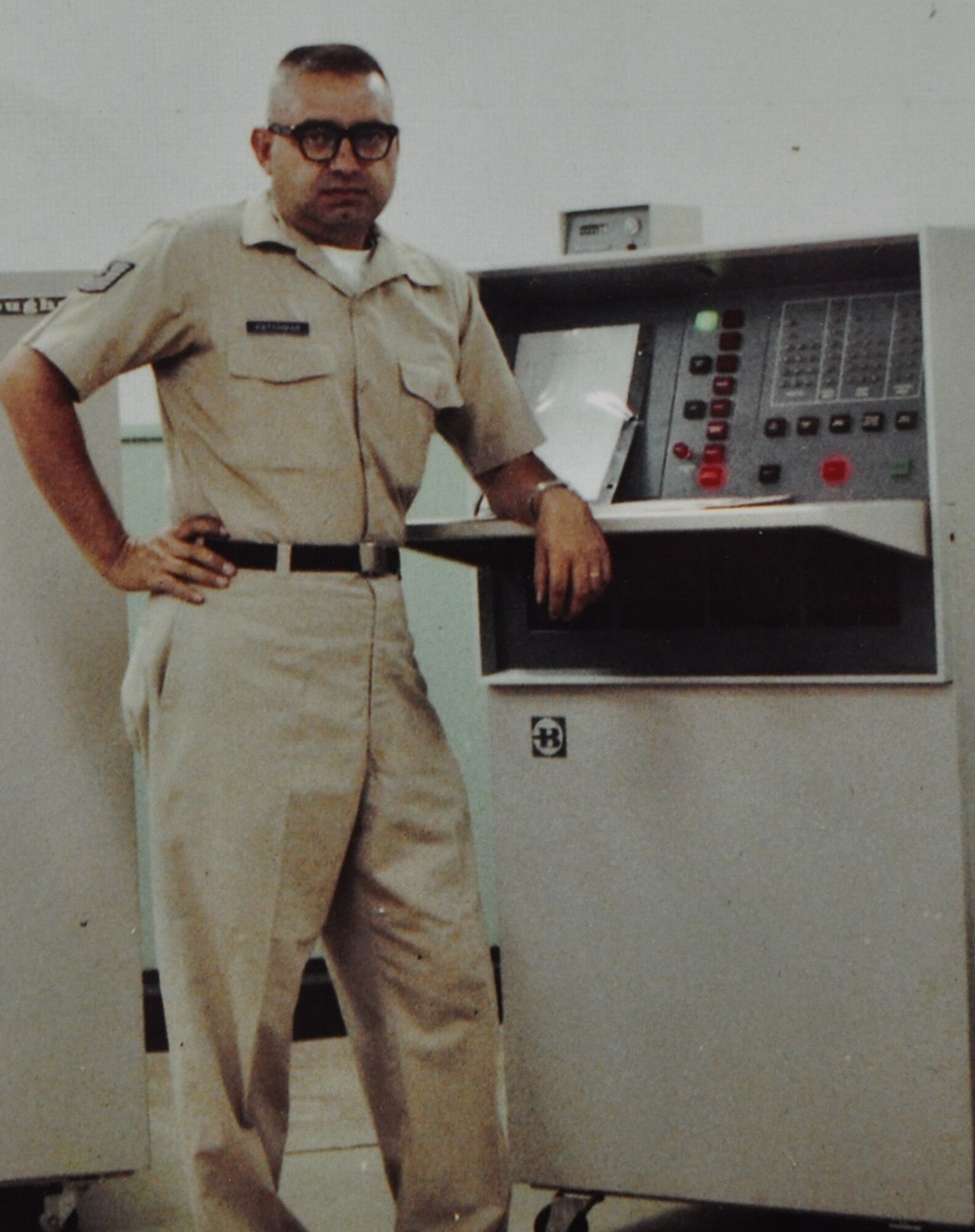 Retired Master Sgt. Sam Katchmar stands next to the Burrough's Fast
Card System in 1966 at Ching Chuan Kang Air Base in Taiwon, China. (Courtesy
photo)
