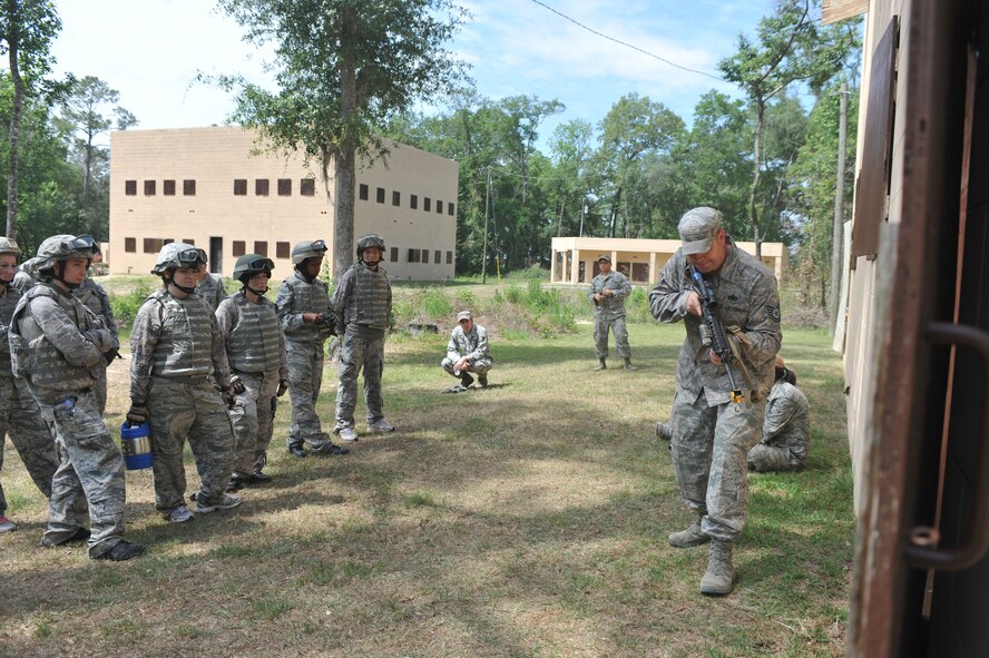 U.S. Air Force Tech Sgt. Sean Gray, 822nd Base Defense Squadron NCO in charge of training, demonstrates military operations in urban terrain techniques during the 822nd Base Defense Squadron spouse immersion day at Moody Air Force Base, Ga., May 4, 2012. The 822nd BDS held spouse immersion day, giving spouses an idea of what 822nd BDS Airmen do daily.(U.S. Air Force photo by Airman 1st Class Jarrod Grammel/Released)
