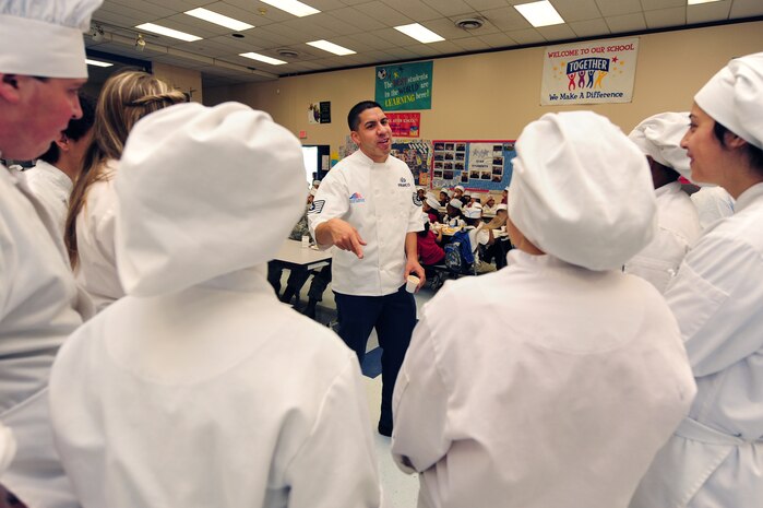 U.S. Air Force Tech Sgt. Justin Franco, 99th Force Support Squadron services craftsman, thanks culinary students from Northwest Career and Technical Academy after a Chefs for Kids event May 3, 2012, at Rex Bell Elementary School in Las Vegas, Nev. The students used their knowledge of cooking, food safety and nutrition to make breakfast for Rex Bell students. (U.S. Air Force photo by Staff Sgt. William P.Coleman)  