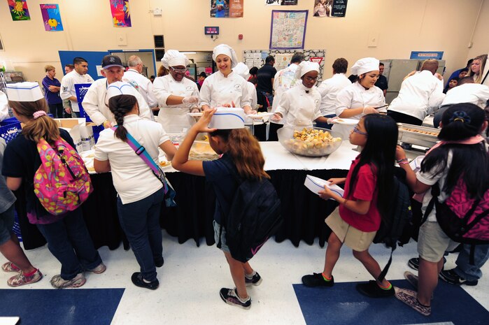 Culinary students from Northwest Career and Technical Academy volunteer at a Chefs for Kids event May 3, 2012, at Rex Bell Elementary School in Las Vegas, Nev. Chefs and other volunteers visit 12 of Clark County's underprivileged  schools throughout the school year, serving a hot and healthy breakfast to all the studentsl. (U.S. Air Force photo by Staff Sgt. William P.Coleman)  