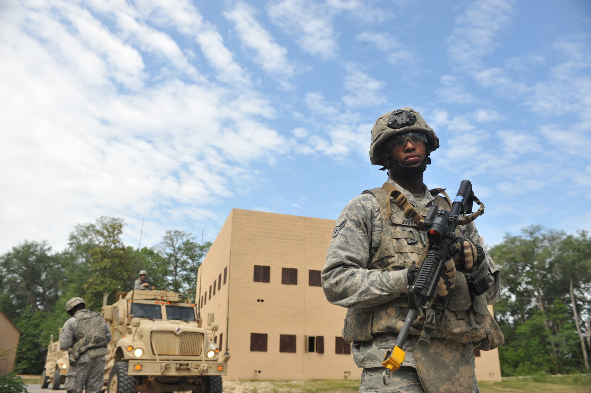 Airman 1st Class Shaun Jordan, 822nd Base Defense Squadron fire team member, patrols during a military operations in urban terrain demo for the 822nd BDS spouse immersion day at Moody Air Force Base, Ga., May 4, 2012. Approximately 30 spouses participated in the 822nd BDS spouse immersion day. (U.S. Air Force photo by Airman 1st Class Jarrod Grammel/Released)
