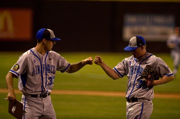 Cadet Michael Ceci, U.S. Air Force Academy Falcons pitcher, congratulates Cadet Mike Kazakoff after pitching a 1- 2-3 inning during a game against the University of Nevada, Las Vegas Rebels April 20, 2012, at Earl E. Wilson Stadium in Las Vegas, Nev. The Falcon's senior cadets had 17 games left in their 2012 season. (U.S. Air Force photo by Airman 1st Class Daniel Hughes)