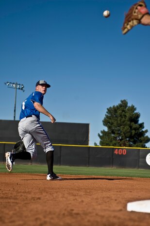 Cadet David Baska, U.S. Air Force Academy Falcons pitcher, tosses a ball into the glove of the second baseman during infield practice before a game against the University of Nevada, Las Vegas Rebels April 20, 2012, at Earl E. Wilson Stadium, in Las Vegas, Nev. Baska is also the punter for the Air Force Academy's football team. (U.S. Air Force photo by Airman 1st Class Daniel Hughes)