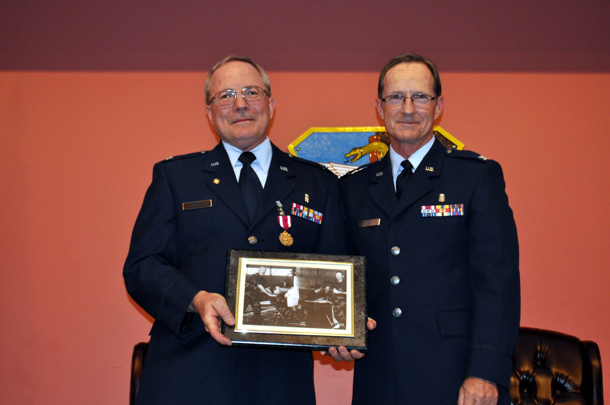 TRAVIS AIR FORCE BASE, Calif. -- Col. Jeffrey Light, 349th Aerospace Medical Squadron office in charge of self-inspection, is joined by friends, family and coworkers, during his retirement ceremony at Travis Air Force Base, Calif., on May 6, 2012. Colonel Light is retiring after 27 years as a Reservist at Travis. (U.S. Air Force photo/Tech. Sgt. Rachel Martinez)