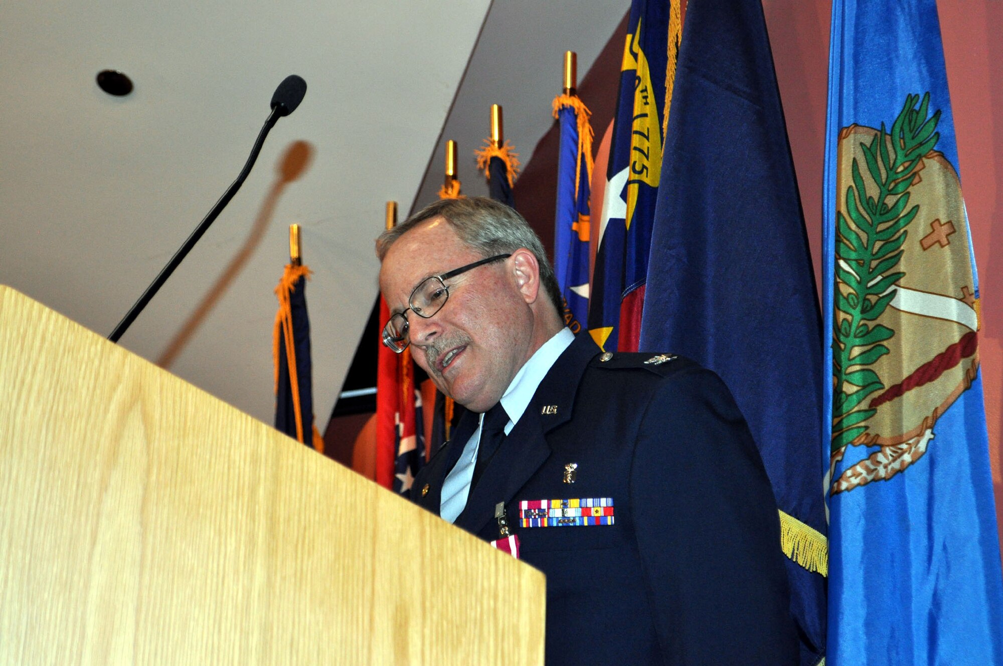 TRAVIS AIR FORCE BASE, Calif. -- Col. Jeffrey Light, 349th Aerospace Medical Squadron office in charge of self-inspection, is joined by friends, family and coworkers, during his retirement ceremony at Travis Air Force Base, Calif., on May 6, 2012. Colonel Light is retiring after 27 years as a Reservist at Travis. (U.S. Air Force photo/Tech. Sgt. Rachel Martinez)