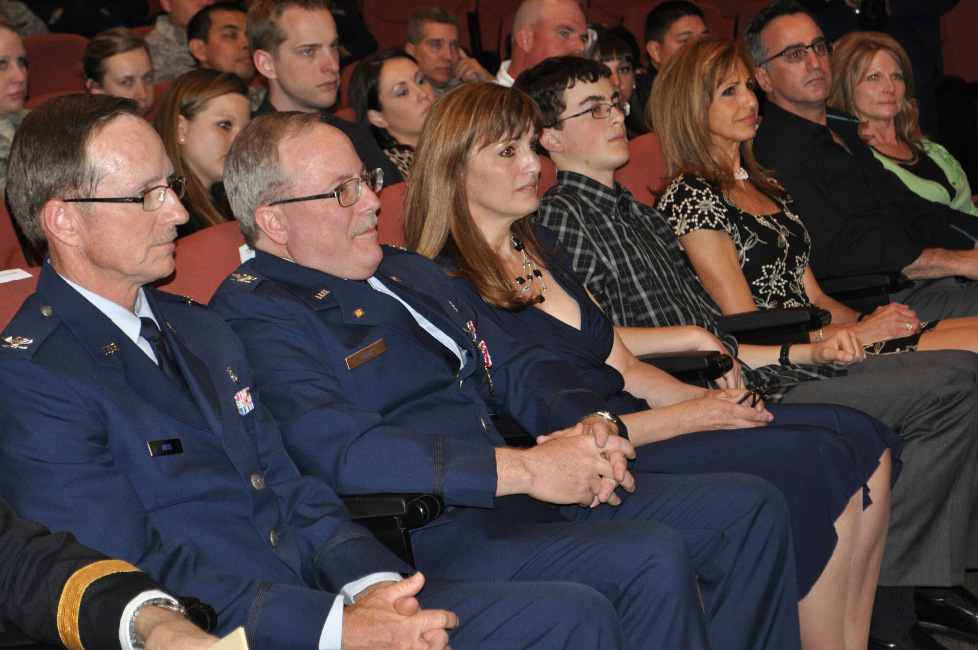 TRAVIS AIR FORCE BASE, Calif. -- Col. Jeffrey Light, 349th Aerospace Medical Squadron office in charge of self-inspection, is joined by friends, family and coworkers, during his retirement ceremony at Travis Air Force Base, Calif., on May 6, 2012. Colonel Light is retiring after 27 years as a Reservist at Travis. (U.S. Air Force photo/Tech. Sgt. Rachel Martinez)