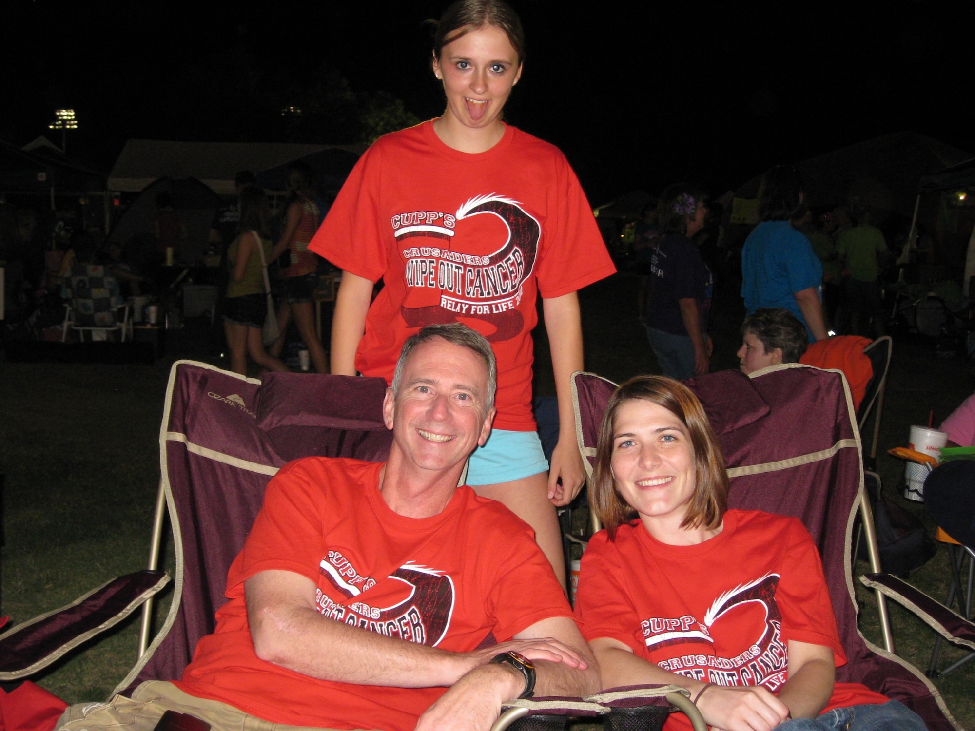 GOODFELLOW AIR FORCE BASE, Texas-- Lt. Col. Andrew Cupp,17th Training Group Deputy Commander, Capt. Holly Hoffman, Medical Operations Squadron and Airman 1st Class Melissa Murphy, 17th TRG, pose for a photo during the 2011 Relay for Life. Cupp is fighting stage 4 Metastatic Melanoma, an aggressive form of cancer. (Courtesy photo) 