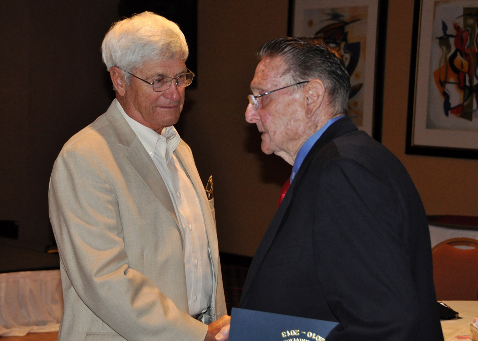 Jack Bernaciak (left) and Romaine Gregg say good-bye following the closing banquet of the 307th Bomb Wing/Group (1946-1954) Reunion April 28, 2012.  The 16th reunion, held in Orlando, Fla., was attended by former ground crew and flight crew members of the 307th and their families.  (U.S. Air Force photo/Master Sgt. Mary Hinson)
