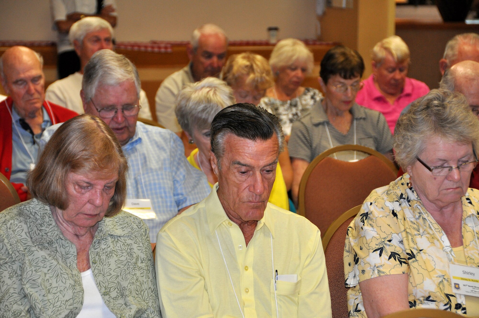 Attendees of the 307th Bomb Wing/Group (1946-1954) Reunion bowed their heads for a moment of silence in respect for all the members who passed away since the last reunion 18 months ago.  The 16th reunion was in Orlando, Fla., April 25-28, 2012, for former 307th ground crew and flight crew members and their families.  (U.S. Air Force photo/Master Sgt. Mary Hinson)