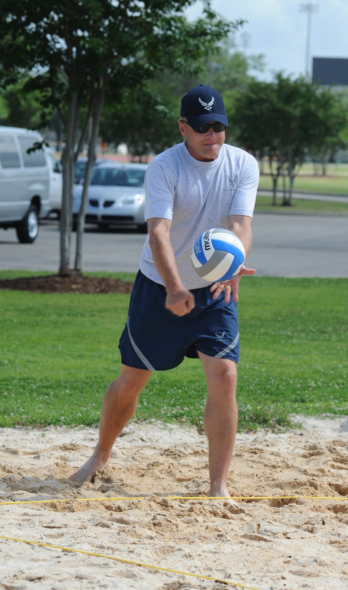 Brig. Gen. Andrew Mueller, 81st Training Wing commander, serves the volleyball in a volleyball match between the commanders and the chiefs during Sports Day May 4, 2012, at Keesler Air Force Base, Miss.  The chiefs defeated the commanders.  Sports Day was held in conjunction with May’s National Physical Fitness and Sports Month.   The event consisted of a variety of sports with participation from the many squadrons on base.  The winner of the small squadron division was 81st Training Support Squadron and the winner of the large squadron division was the 334th Training Squadron.  (U.S. Air Force photo by Kemberly Groue)