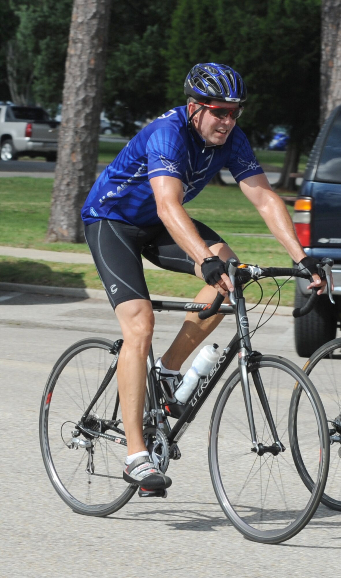 Capt. Joel Elliott, 81st Surgical Operations Squadron, bikes his way around base during a 10 mile bike trek for Sports Day May 4, 2012, at Keesler Air Force Base, Miss.  Sports Day was held in conjunction with May’s National Physical Fitness and Sports Month.   The event consisted of a variety of sports with participation from the many squadrons on base.  The winner of the small squadron division was 81st Training Support Squadron and the winner of the large squadron division was the 334th Training Squadron.  (U.S. Air Force photo by Kemberly Groue)
