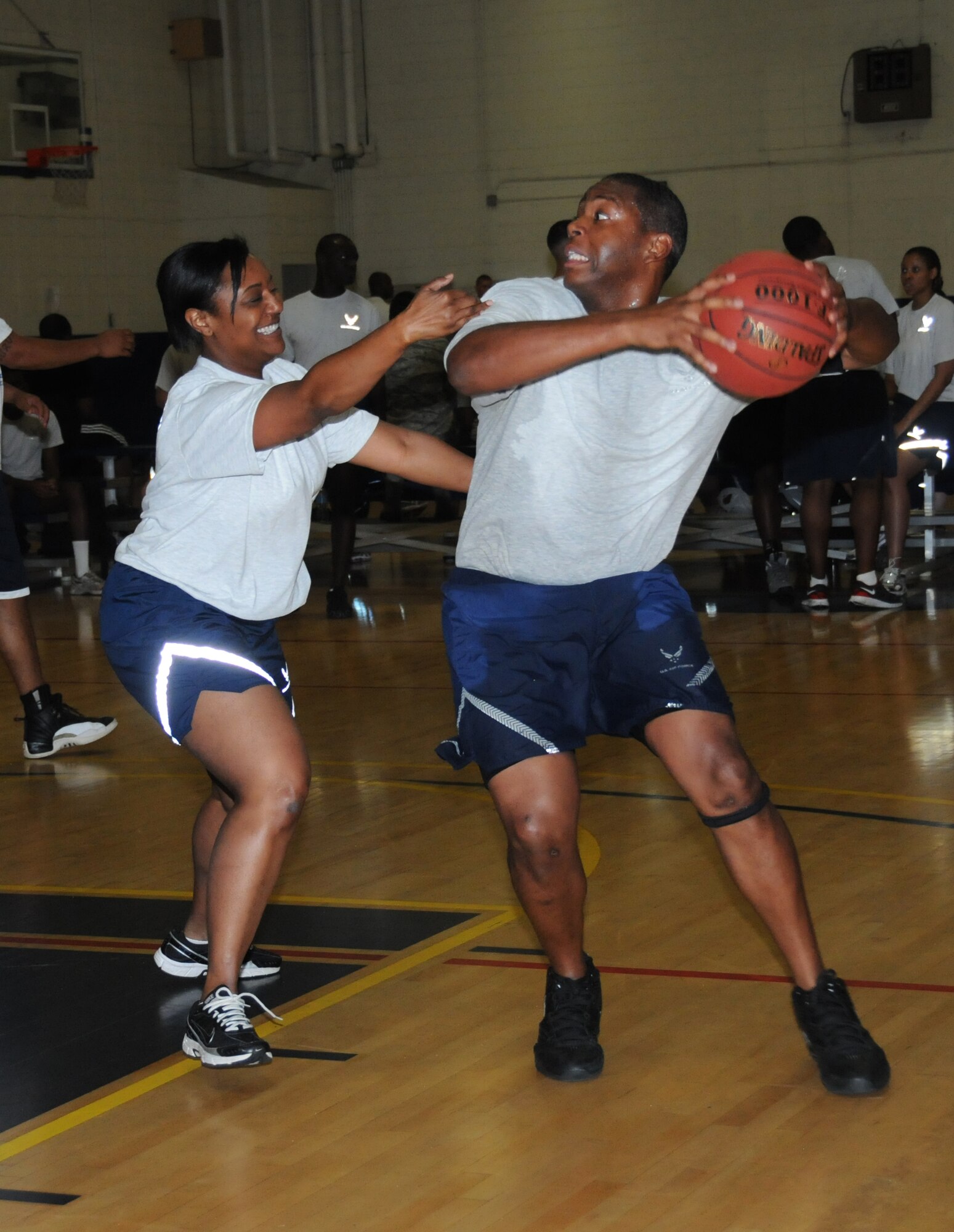 Capt. Jewel Henry , 81st Medical Operations Squadron, plays defense against Staff Sgt. V.J. Peoples, 335th Training Squadron Hybrid team, during a 3-on-3 basketball tournament at the Blake Fitness Center for Sports Day May 4, 2012, at Keesler Air Force Base, Miss.  Sports Day was held in conjunction with May’s National Physical Fitness and Sports Month. The Hybrids defeated the 81st MDOS, 12-5.  The event consisted of a variety of sports with participation from the many squadrons on base.  The winner of the small squadron division was 81st Training Support Squadron and the winner of the large squadron division was the 334th Training Squadron.  (U.S. Air Force photo by Kemberly Groue)