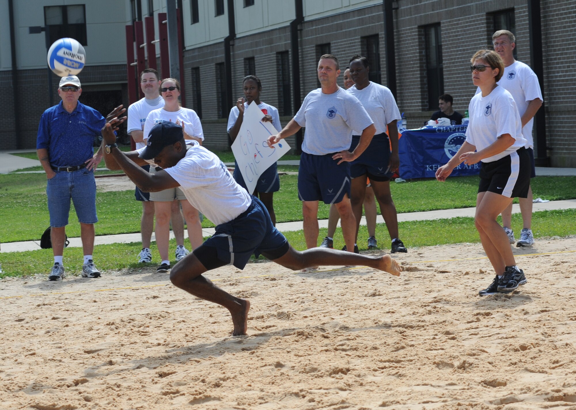 Chief Master Sgt. Anthony Pearson, 334th Training Squadron, stretches out for the ball in a volleyball match between the commanders and the chiefs during Sports Day May 4, 2012, at Keesler Air Force Base, Miss.  The chiefs defeated the commanders.  Sports Day was held in conjunction with May’s National Physical Fitness and Sports Month.   The event consisted of a variety of sports with participation from the many squadrons on base.  The winner of the small squadron division was 81st Training Support Squadron and the winner of the large squadron division was the 334th Training Squadron.  (U.S. Air Force photo by Kemberly Groue)