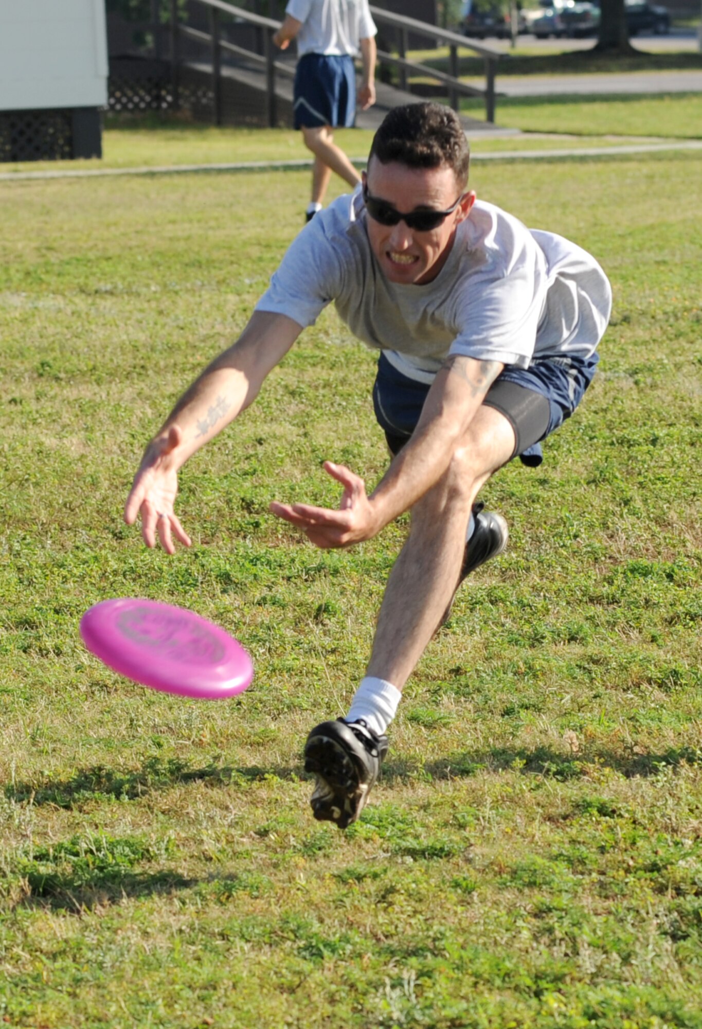 Capt. Glen Lewis, 333rd Training Squadron, stretches out for the catch during an Ultimate Frisbee tournament for Sports Day May 4, 2012, at Keesler Air Force Base, Miss.  Sports Day was held in conjunction with May’s National Physical Fitness and Sports Month.   The event consisted of a variety of sports with participation from the many squadrons on base.  The winner of the small squadron division was 81st Training Support Squadron and the winner of the large squadron division was the 334th Training Squadron.  (U.S. Air Force photo by Kemberly Groue)