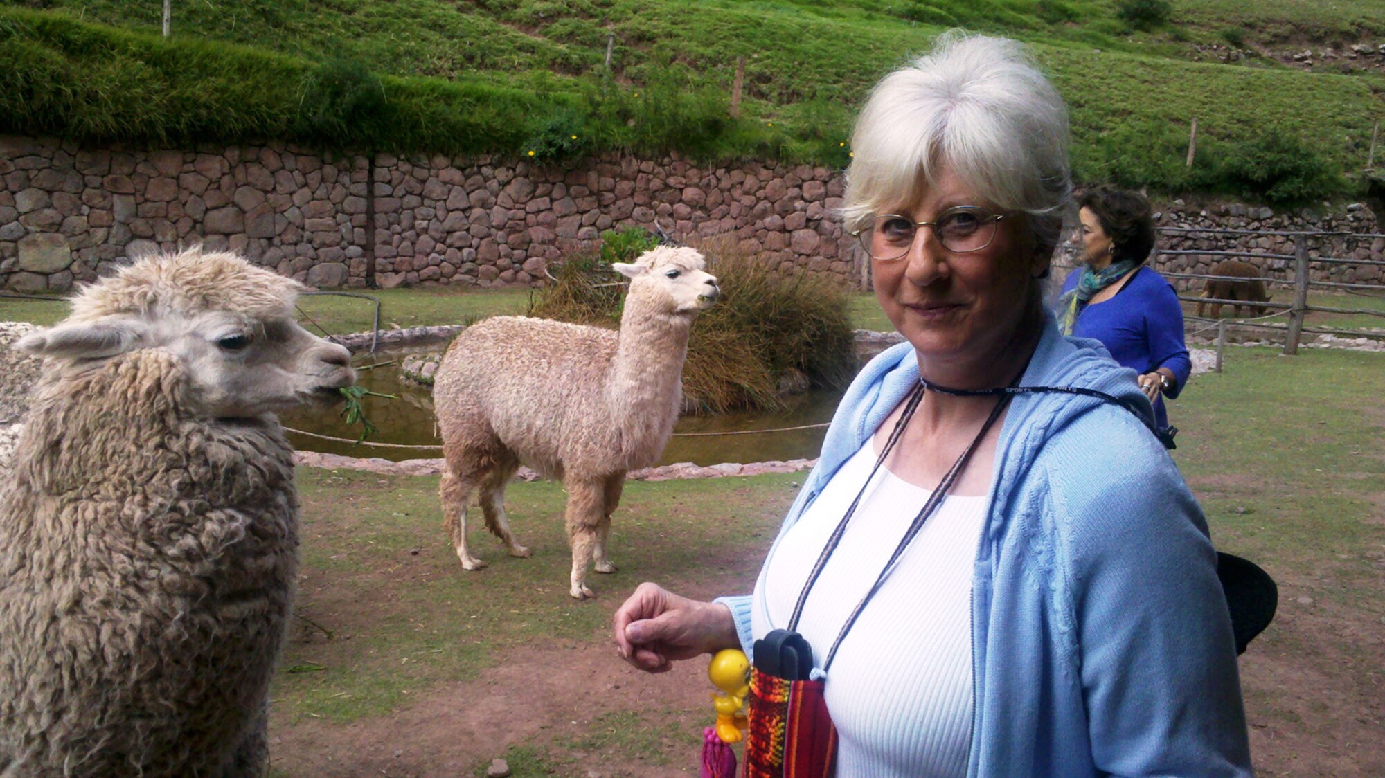 Sharon Butcher, an Information International Associates (IIa) Inc. resource librarian at AEDC’s Technical Library, posed with some of the local animals before she was allowed to feed them. 