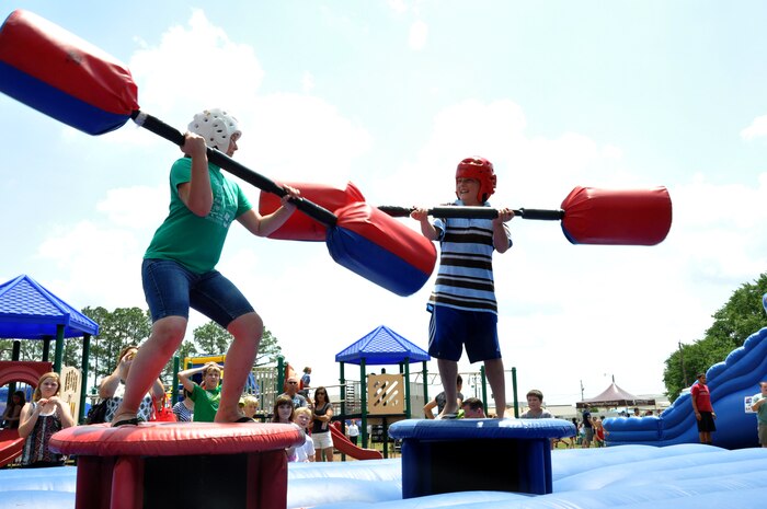 Two "junior" 315th Airmen battle it out with pugil sticks at the Joint Base Charleston Annual Picnic, May 5. (U.S. Air Force photo/Tech. Sgt. Scott Mathews)