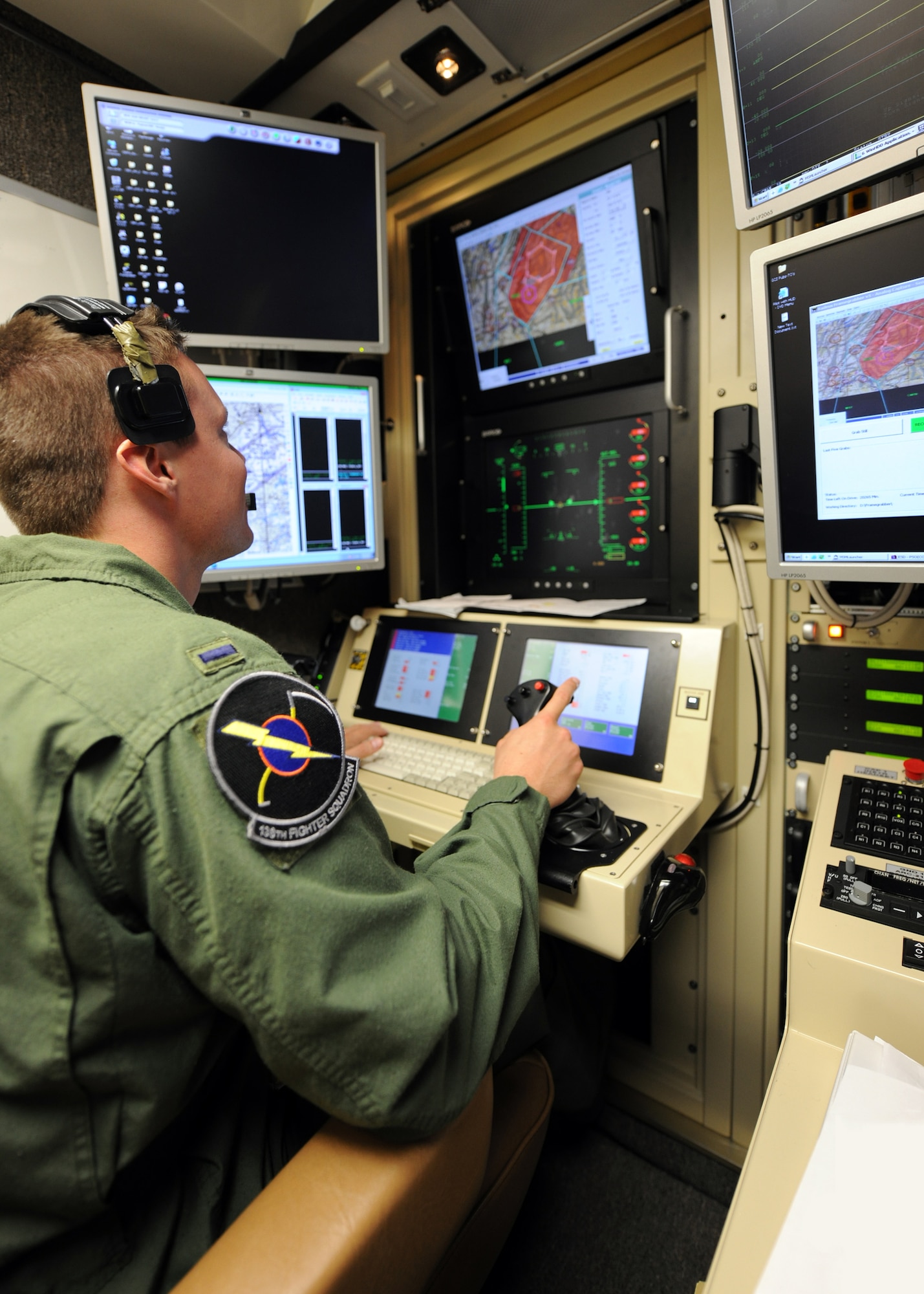 A student pilot mans the controls of a MQ-9 Reaper in a ground-based cockpit during a training mission flown from Hancock Field Air National Guard Base, Syracuse, New York.  The 174th Fighter Wing operates the only MQ-9 Formal Training Unit (FTU) in the Air National Guard to train aircrews from the active duty Air Force, Air National Guard and Air Force Reserve. (Photo by Tech. Sgt. Ricky Best/ Released)
