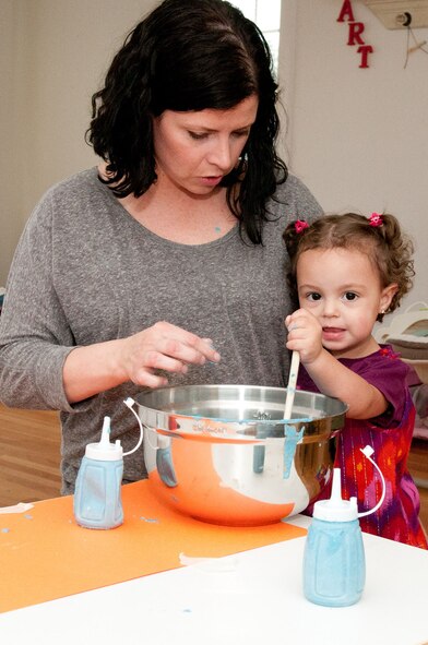 HANSCOM AIR FORCE BASE, Mass – Family Child Care provider Rachel Perez works with McKenna Perez on a project May 8. Hanscom is celebrating Provider Appreciation Day May 11 by thanking all child care providers from FCC, the Child Development Center and School Age program. (Photo by Rick Berry)