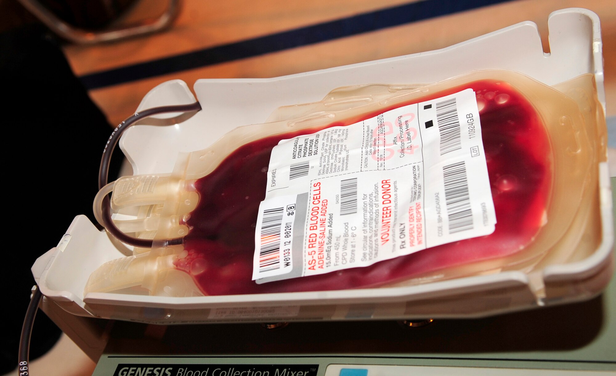 RAF MILDENHALL, England – A blood collection mixer helps mix donated blood with anticoagulant in a collection bag during a blood drive here May 8, 2012. After being collected, the blood is bagged, labeled and put on ice while it awaits transport to a proper holding facility. (U.S. Air Force photo/Senior Airman Ethan Morgan)