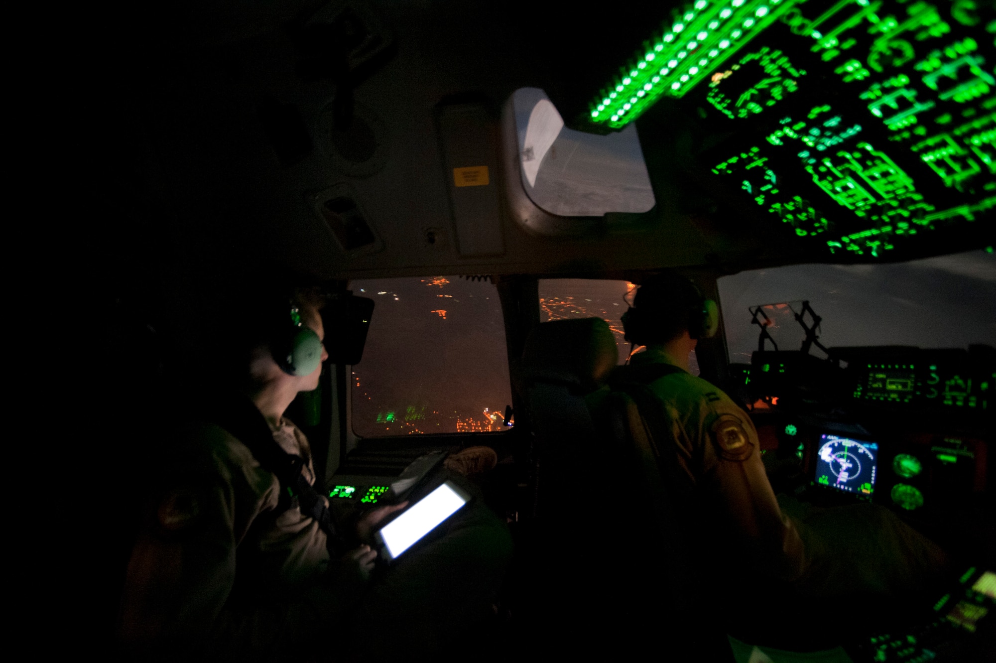 C-17 Globemaster III pilots, 1st Lt. Karl Johnson, left, and Capt. Nate Chott, 6th Airlift Squadron, fly a C-17 from Kabul International Airport, Afghanistan, to Incirlik Air Base, Turkey, May 5, 2012. The C-17 air crew from Joint Base McGuire-Dix-Lakehurst, N.J., transported a Turkish air force UH-60 Black Hawk helicopter to Kabul from Incirlik earlier that day. The joint support mission provided smooth delivery of the helicopter to replace one that crashed December 2011. (U.S. Air Force photo by Senior Airman Anthony Sanchelli/Released)
