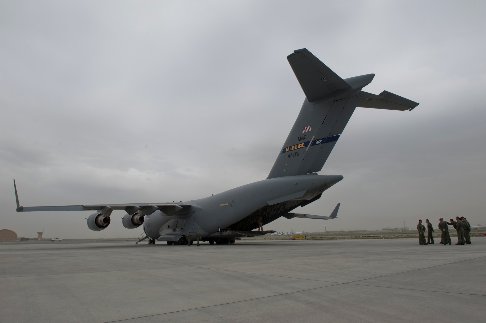 Turkish air force members gather behind a U.S. Air Force C-17 Globemaster III before unloading a TURAF UH-60 Black Hawk helicopter May 5, 2012, at Kabul International Airport, Afghanistan. The C-17 aircrew from Joint Base McGuire-Dix-Lakehurst, N.J., transported the helicopter to Kabul from Incirlik Air Base, Turkey. The joint support mission provided smooth delivery of the helicopter to replace one that crashed December 2011. (U.S. Air Force photo by Senior Airman Anthony Sanchelli/Released)