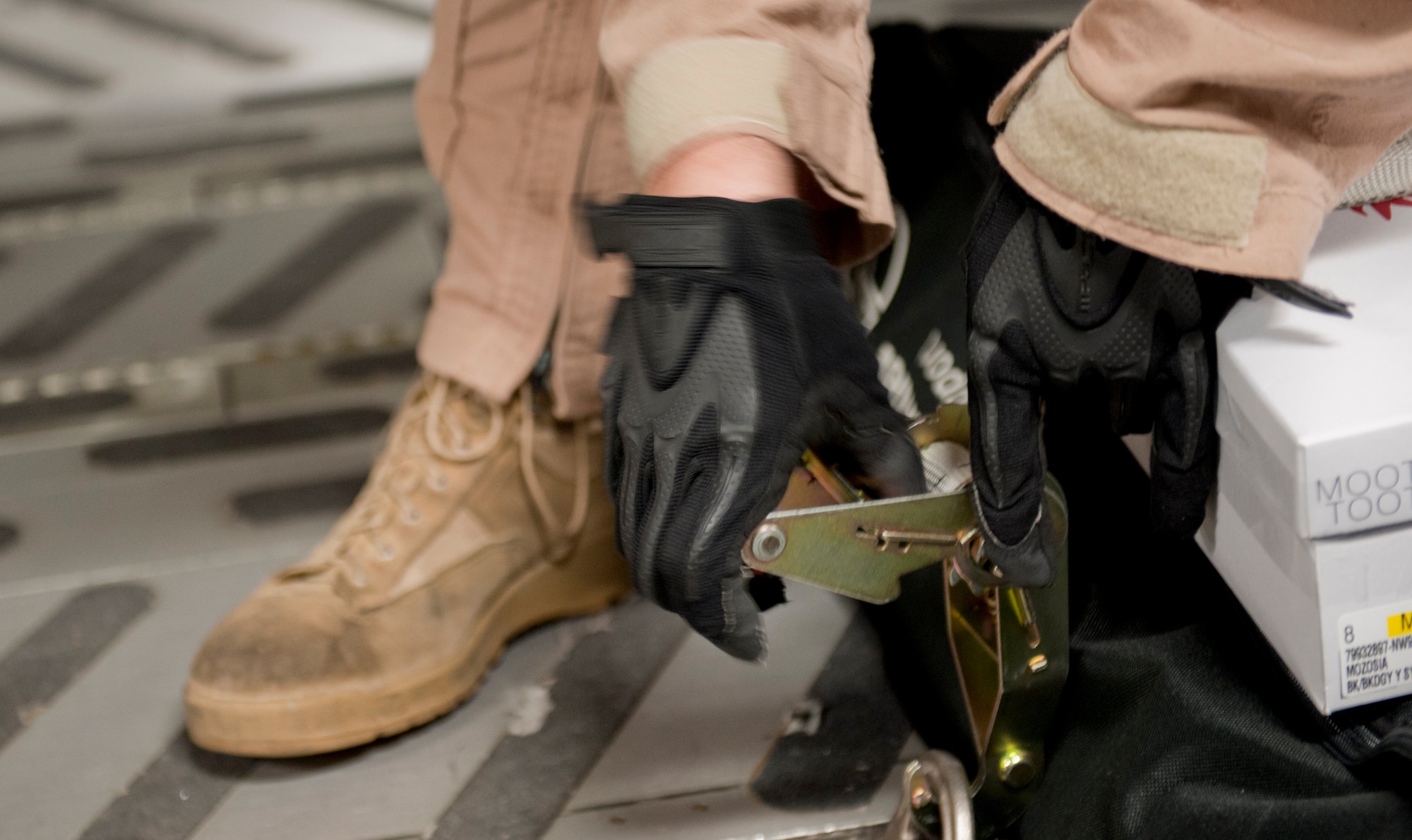 Staff Sgt. Micah Hackett, 6th Airlift Squadron loadmaster, straps down boxes and equipment on a C-17 Globemaster III May 4, 2012, at Incirlik Air Base, Turkey. The C-17 aircrew from Joint Base McGuire-Dix-Lakehurst, N.J., transported a Turkish air force UH-60 Black Hawk helicopter to Kabul, Afghanistan, May 5, 2012. The joint support mission provided smooth delivery of the helicopter to replace one that crashed December 2011. (U.S. Air Force photo by Senior Airman Anthony Sanchelli/Released)