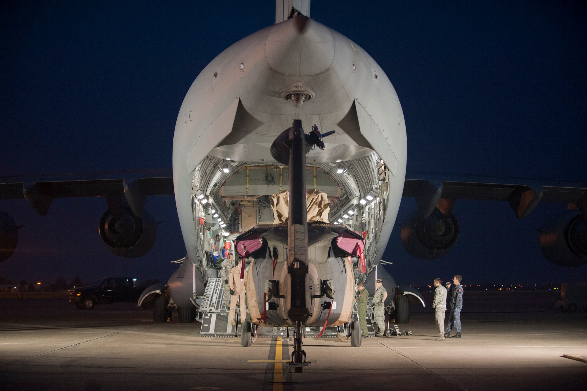 A Turkish air force UH-60 Black Hawk helicopter is loaded onto a U.S. Air Force C-17 Globemaster III May 1, 2012, at Incirlik Air Base, Turkey. A C-17 aircrew from Joint Base McGuire-Dix-Lakehurst, N.J., transported the helicopter to Kabul, Afghanistan, May 5, 2012. The joint support mission provided smooth delivery of the helicopter to replace one that crashed December 2011. (U.S. Air Force photo by Senior Airman Anthony Sanchelli/Released)