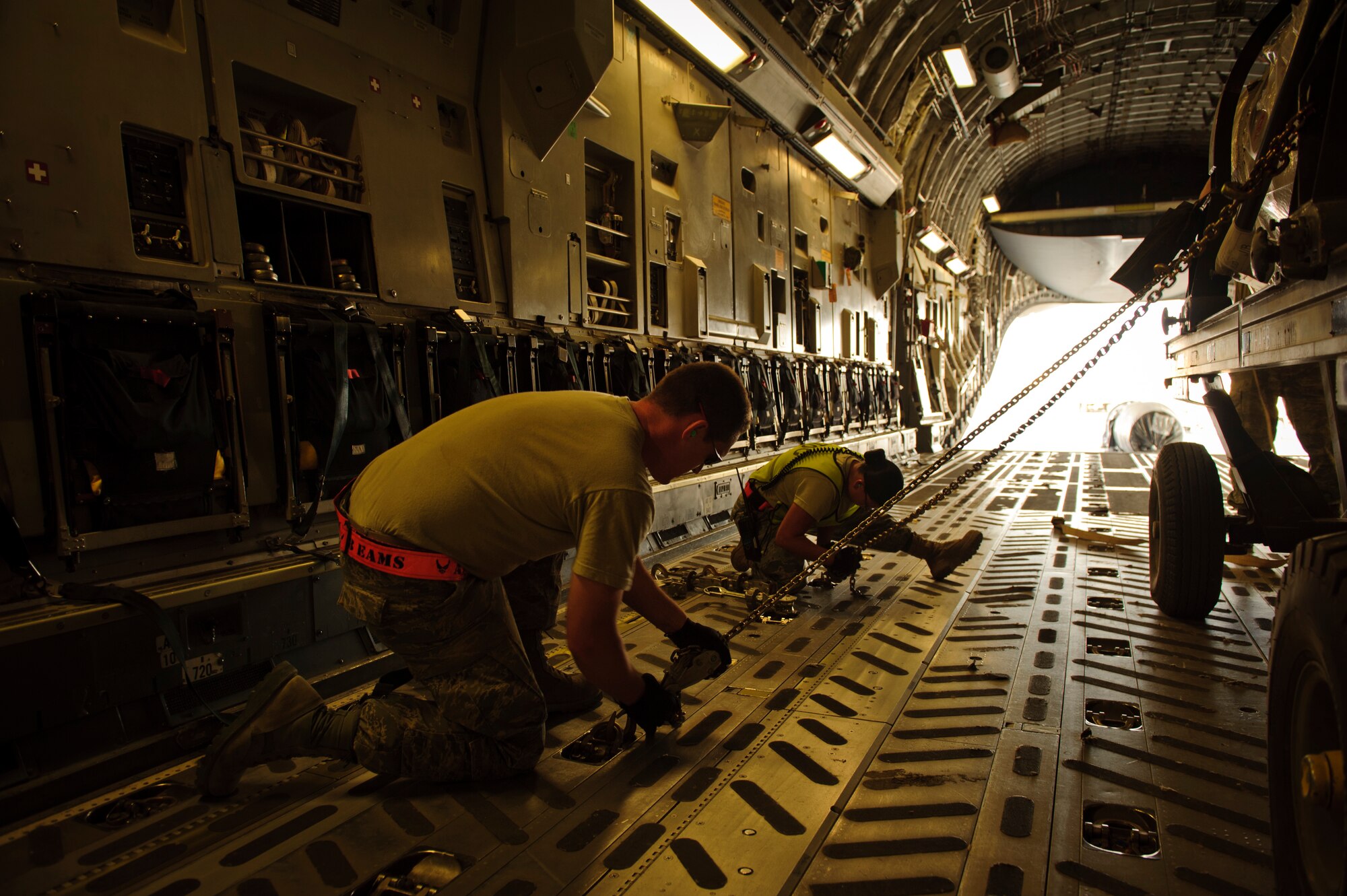 SOUTHWEST ASIA – Airmen from the 8th Expeditionary Air Mobility Squadron secure an aircraft engine inside a C-17 Globemaster III for loading here April 25, 2012. (U.S. Air Force photo/Staff Sgt. Nathanael Callon)