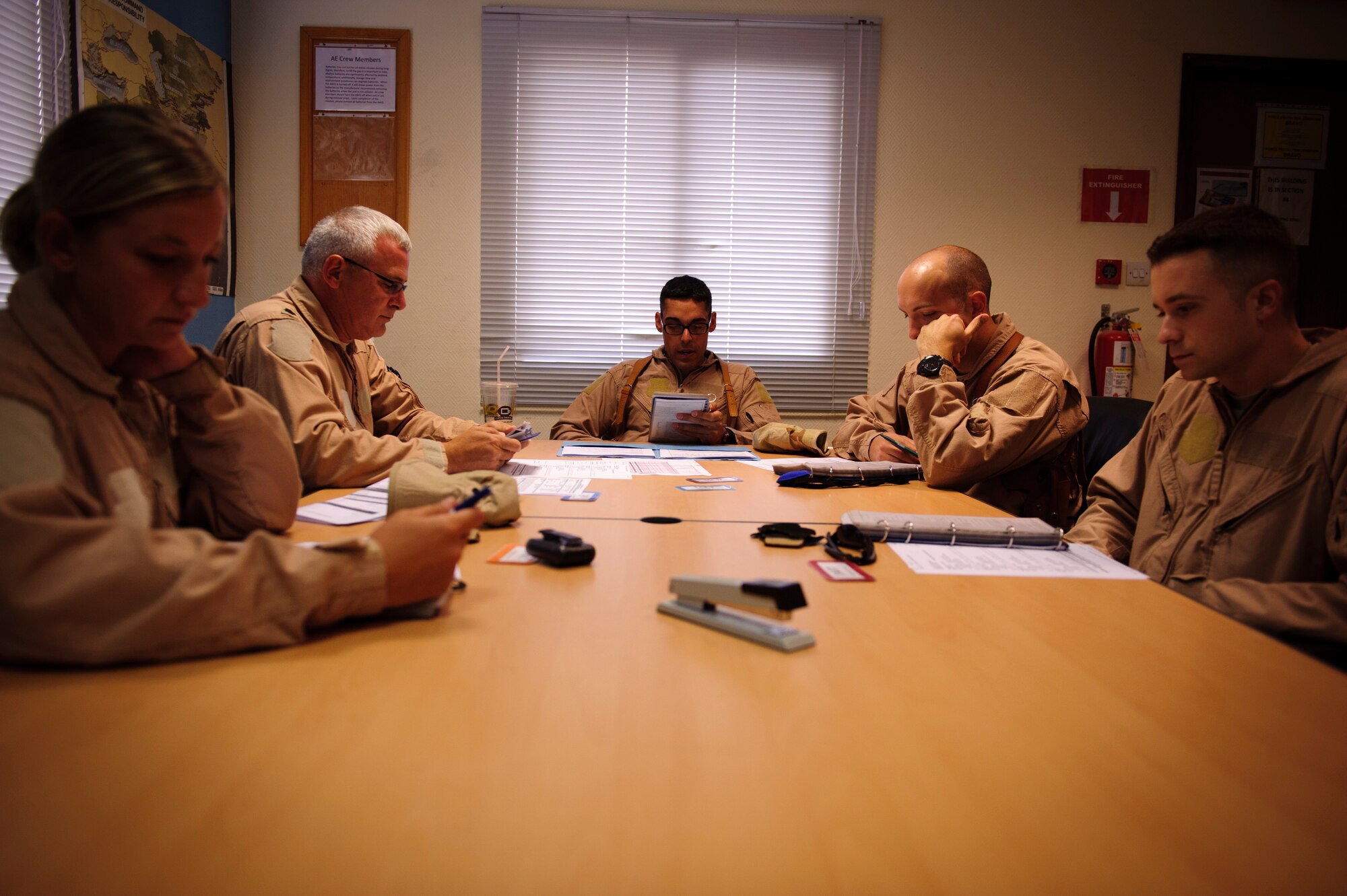 SOUTHWEST ASIA – Members of the 379th Expeditionary Aeromedical Evacuation Squadron review medical records before an evacuation mission here April 21, 2012. The team reviews each patient’s situation before transporting them to or from the battlefield. (U.S. Air Force photo/Staff Sgt. Nathanael Callon)