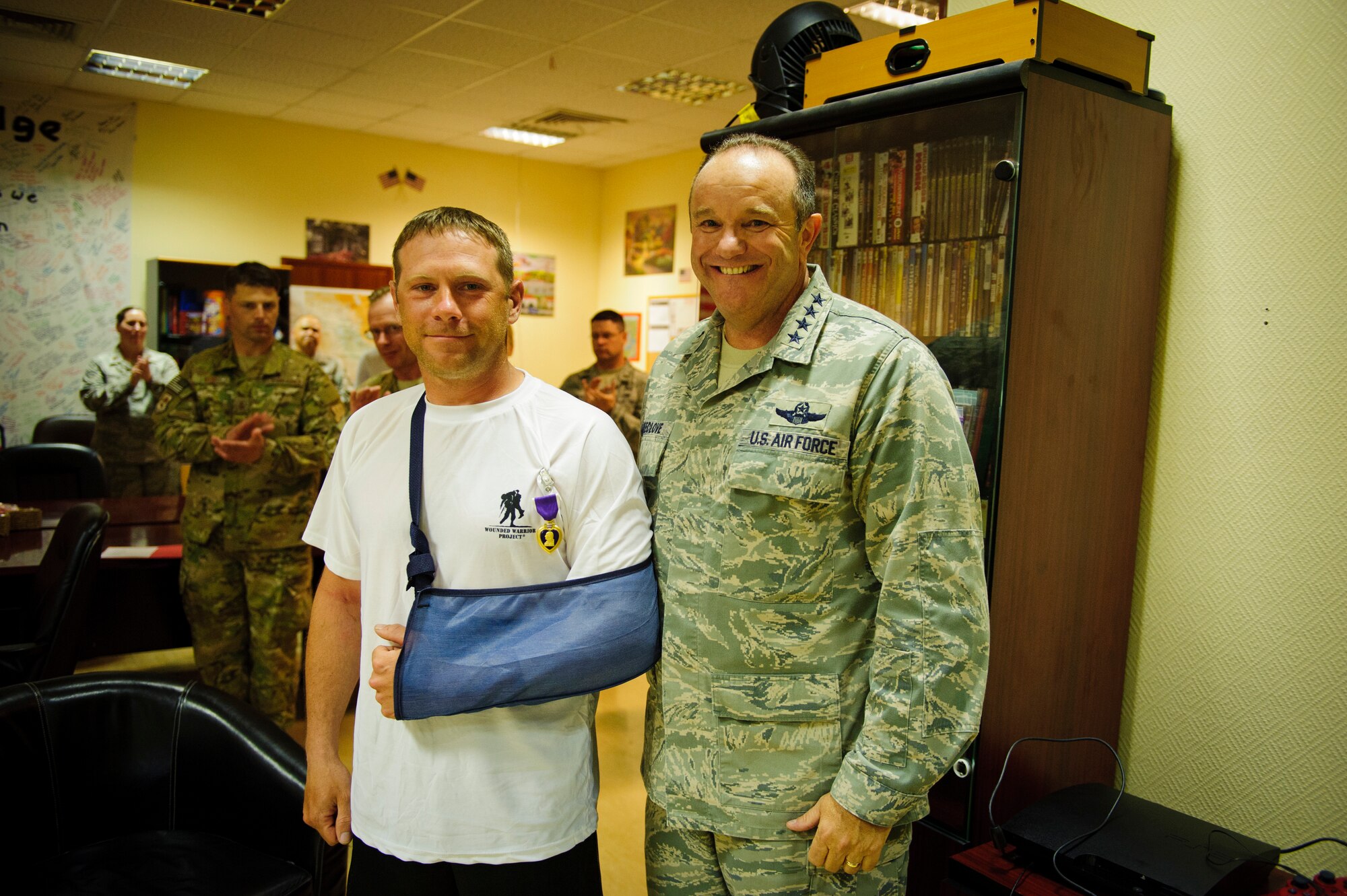 Air Force Vice Chief of Staff Gen. Phil Breedlove poses for a photograph with Tech. Sgt. Jake Tieman after presenting him the Purple Heart at a base in Southwest Asia May 7, 2012.  Tieman is a member of the 577th Expeditionary Civil Engineer Squadron's Base Engineer Emergency Force, also known as "Prime BEEF."  He was wounded by shrapnel near a forward operating base in Afghanistan. 

