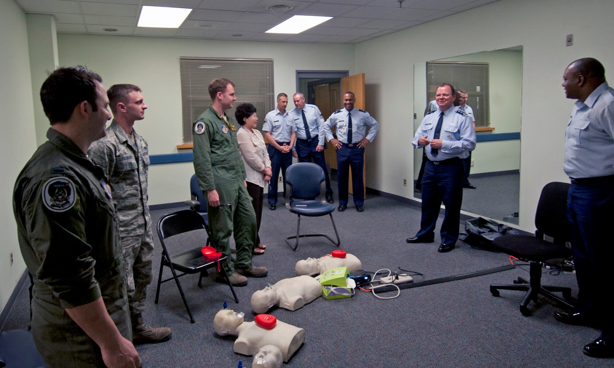 Lt. Gen. Bruce Green, center, Air Force surgeon general, greets a CPR class at the 8th Medical Group on Kunsan Air Base, Republic of Korea, May 9, 2012. The general stopped by several sections of the 8th MDG to greet Airmen and civilian workers. (U.S. Air Force photo/Senior Airman Jessica Hines)   