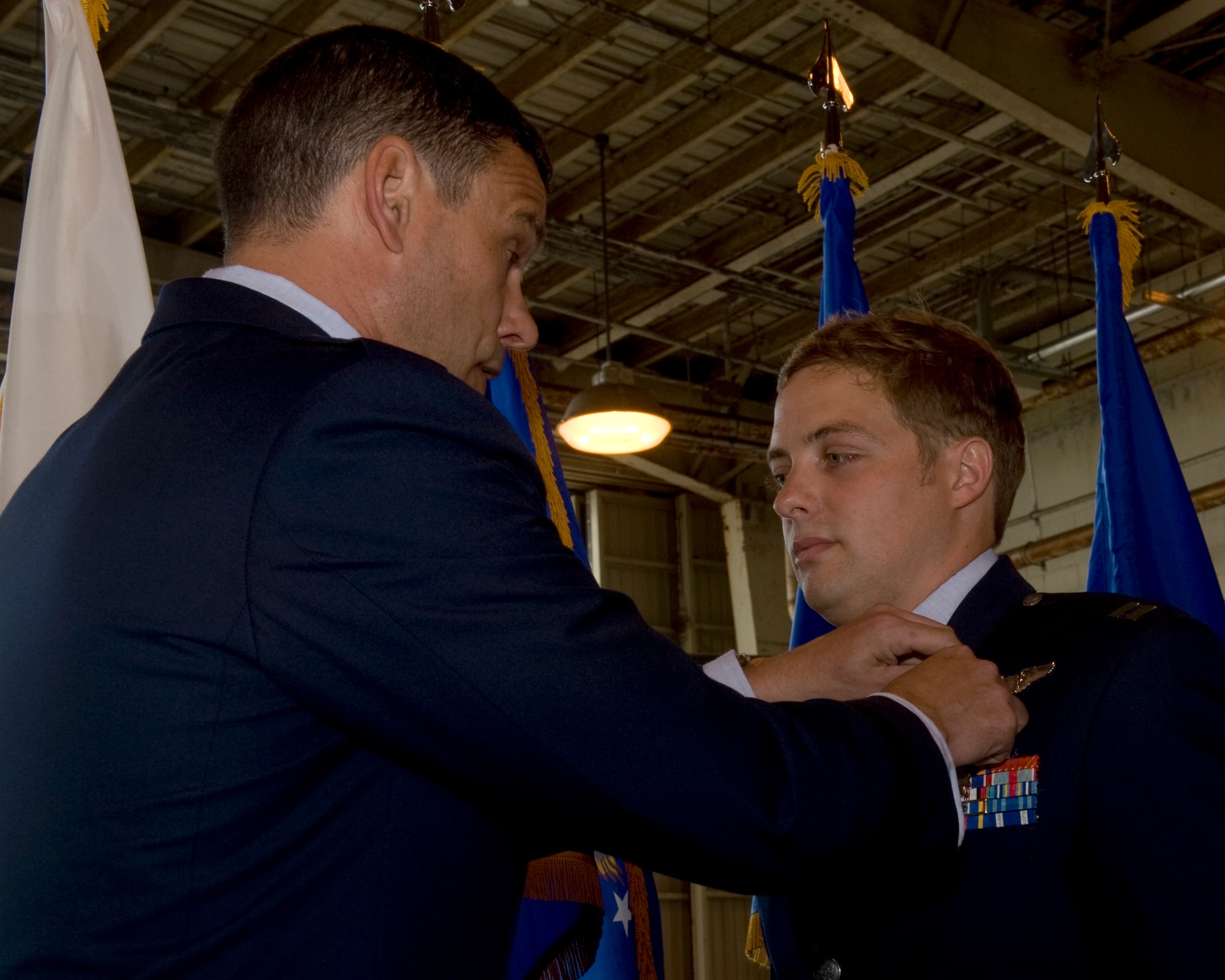 U.S.  Air Force Brig. Gen. Matt Molloy, 18th Wing commander, awards Capt. Louis Nolting, 33rd Rescue Squadron, HH-60 Pave Hawk helicopter pilot, the Distinguished Flying Cross on Kadena Air Base, Japan, May 8, 2012. This medal was awarded to Nolting for his heroic actions and superior flying during a combat rescue mission in Afghanistan, March 29, 2011. His actions not only saved his life, but the lives of his entire crew. (U.S. Air Force photo/Staff Sgt. Laszlo Babocsi)